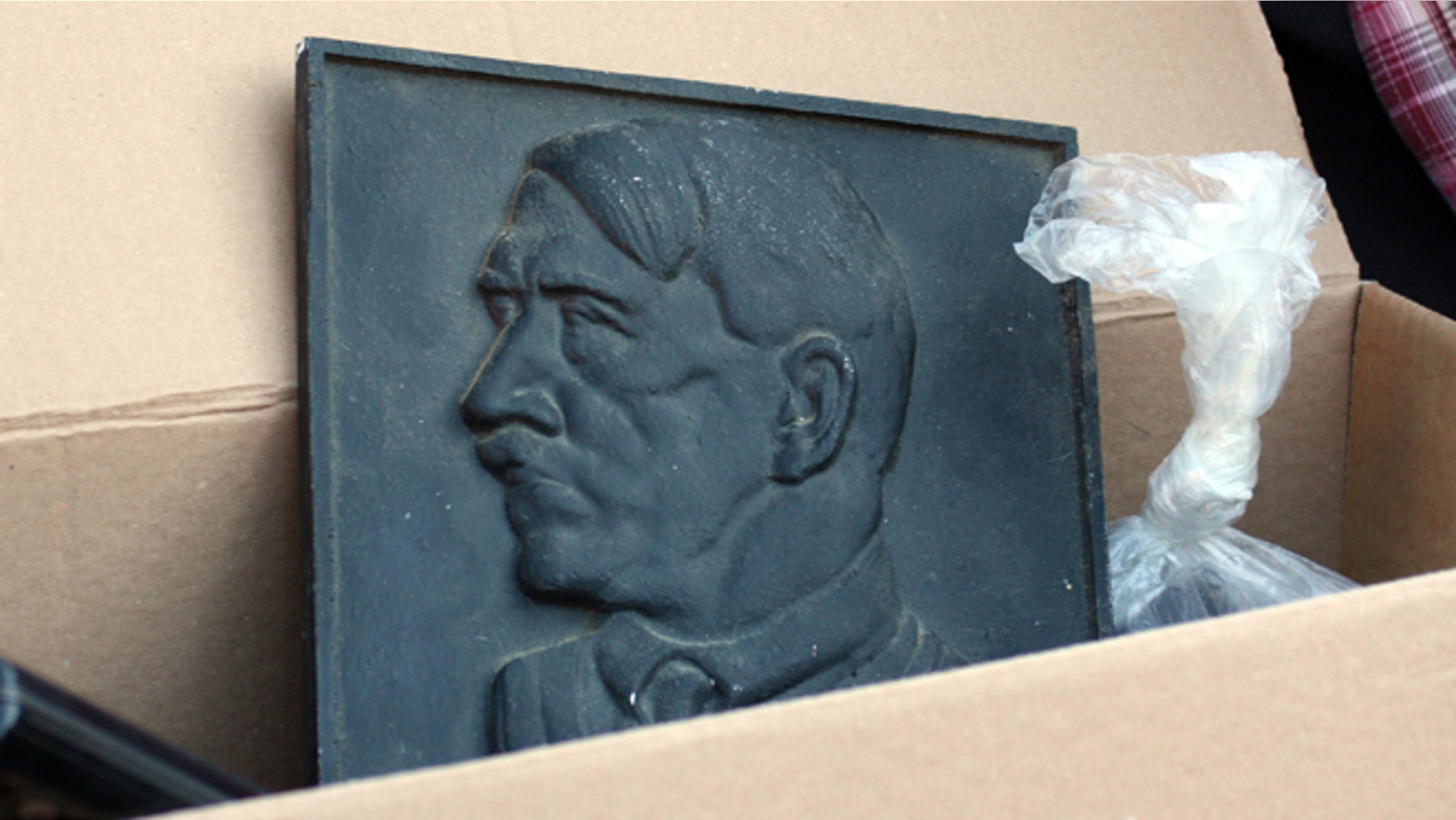 August 23, 2012: A representation of Adolf Hitler lies in a box after police searched the house of an alleged neo-Nazi in Juelich, western Germany.
