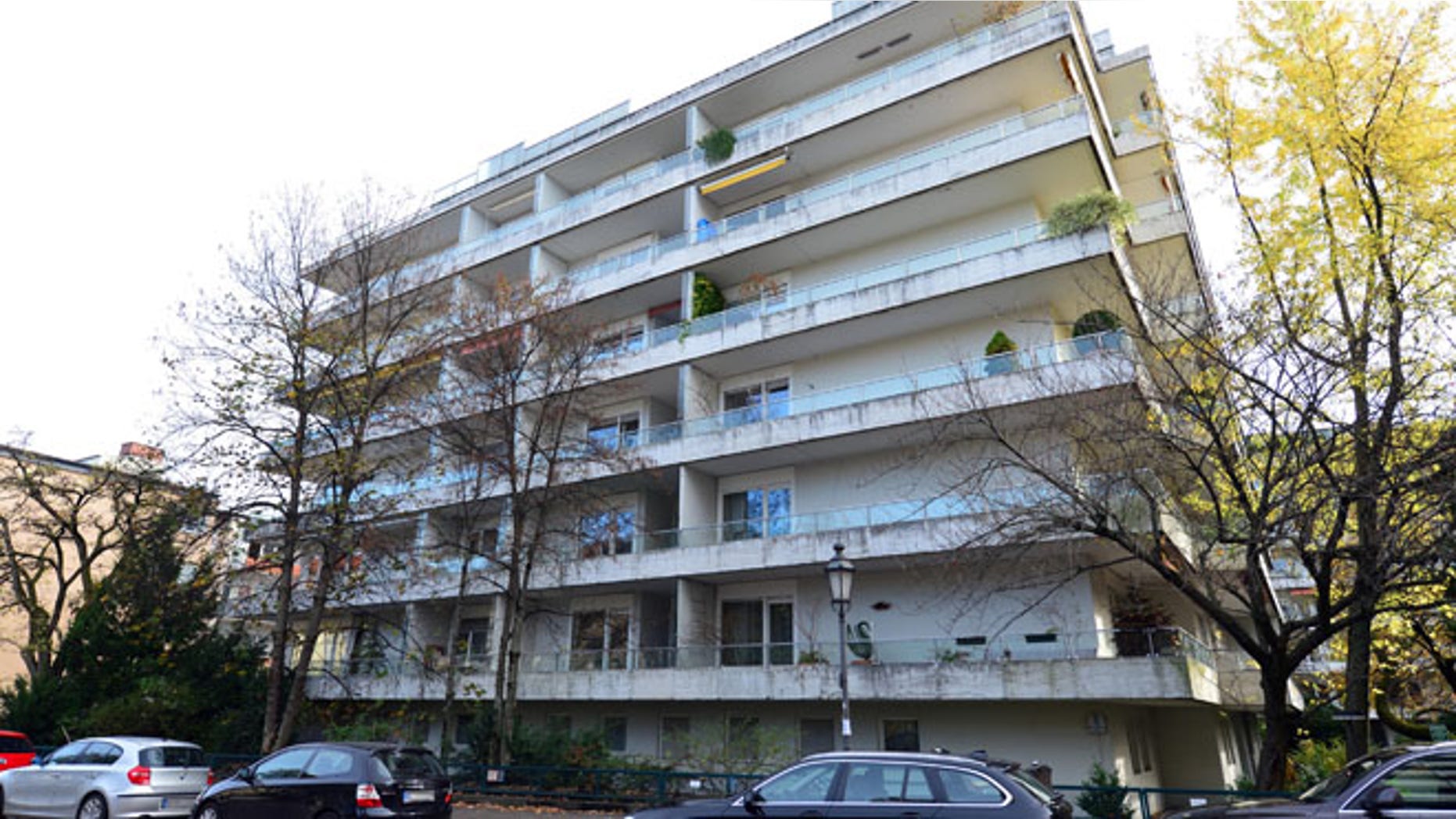 Nov. 4, 2013: In this file photo cars are parked outside the apartment building in Munich, Germany, where more than 1,400 artworks were found in the apartment of collector Cornelius Gurlitt.