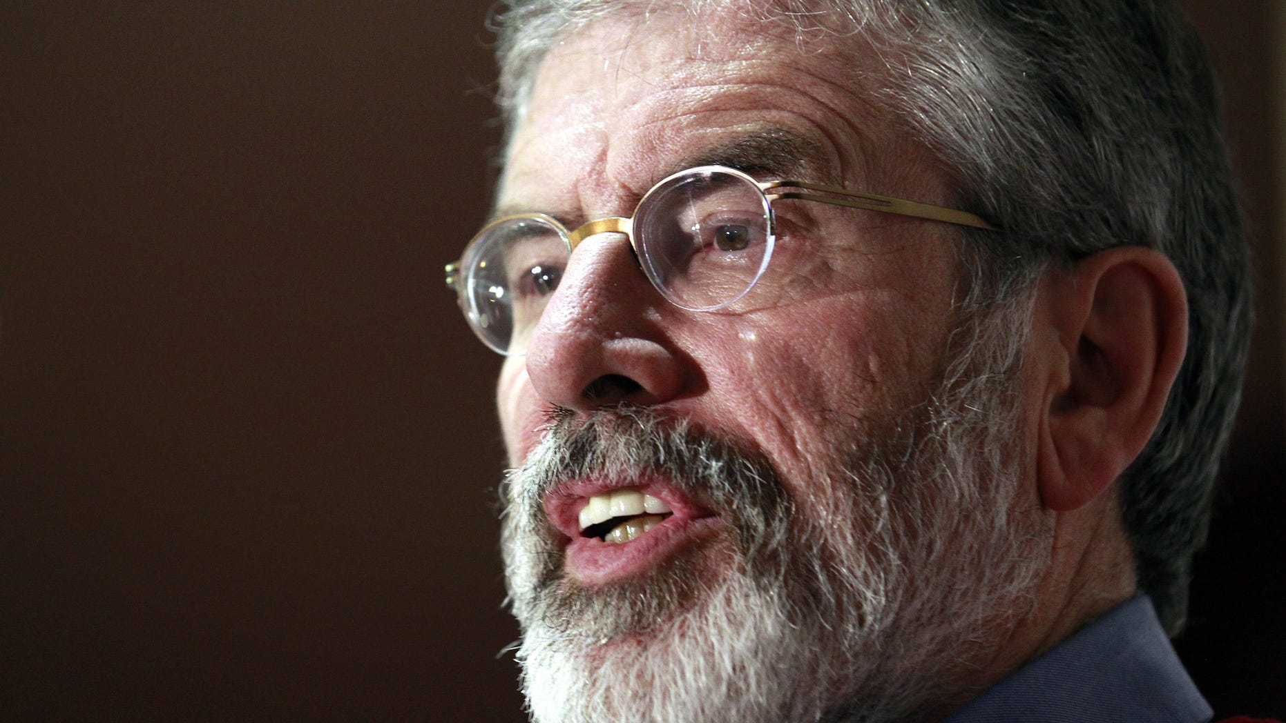Dec. 31, 2013 - FILE photo of Sinn Fein President Gerry Adams in Belfast, Northern Ireland. Sinn Fein Stormont Assembly member Raymond McCartney said police told Adams’ wife, Collette, they had information of a ‘credible threat' to his life.