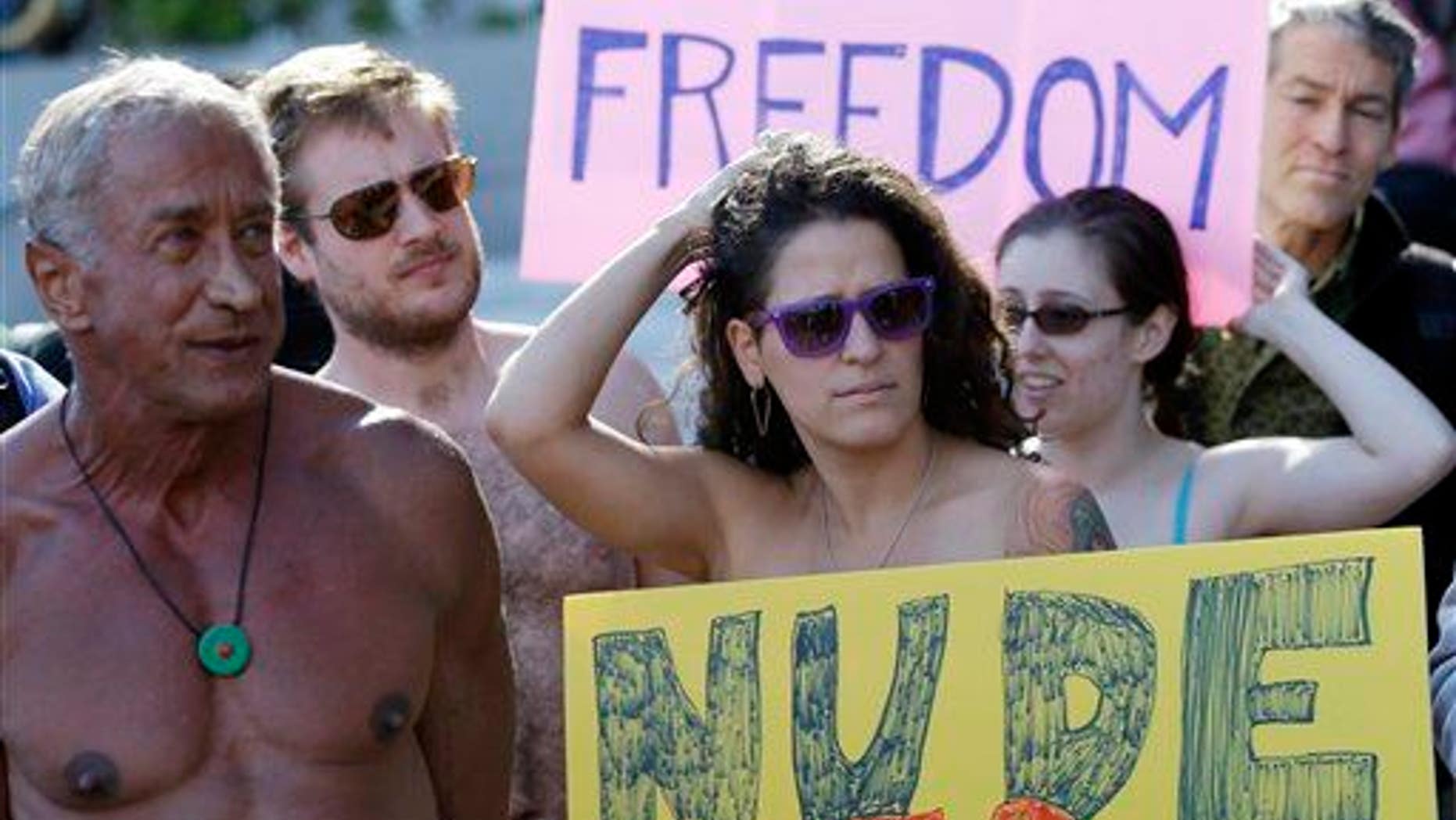 Demonstrators gather outside of City Hall in San Francisco for a protest against a proposed city-wide nudity ban, Wednesday, Nov. 14, 2012.