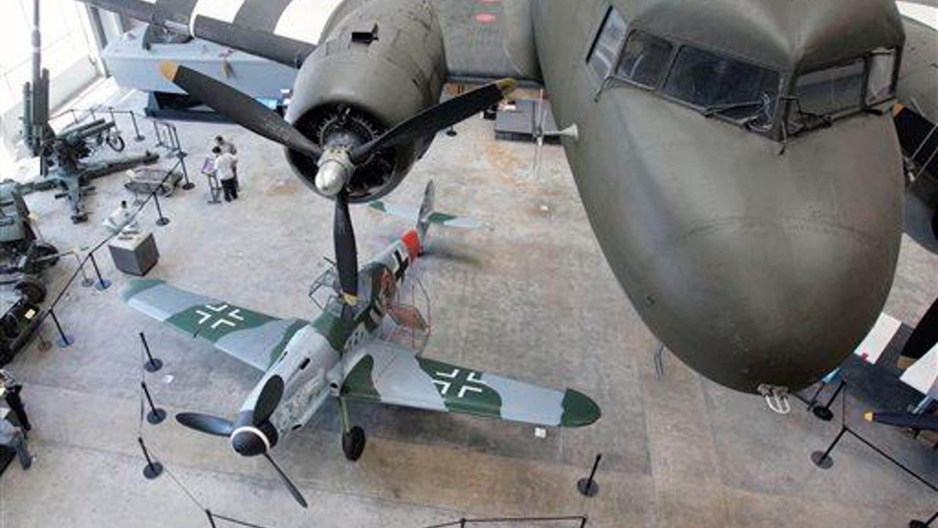 In this 2008 file photo, a German Messerschmitt Bf 109 sits beneath an American C-47 transport aircraft on display at the National World War II Museum in New Orleans.