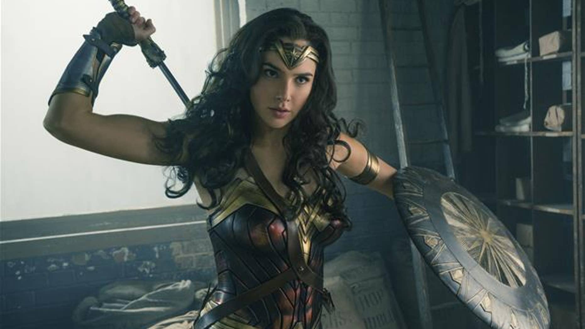 Wonder Woman works up an appetite for a thinkThin-brand protein nut bar.