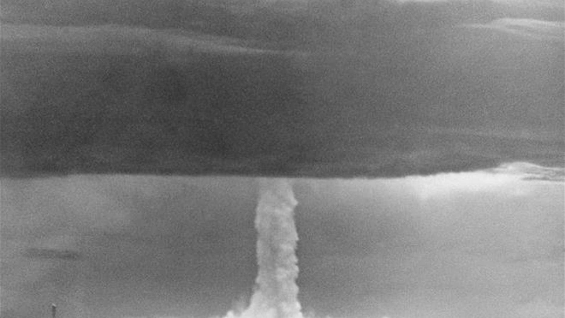 In this May 21, 1956 photo, the stem of a hydrogen bomb moves upward through a heavy cloud after the bomb was detonated over Namu Island in the Bikini Atoll, Marshall Islands.