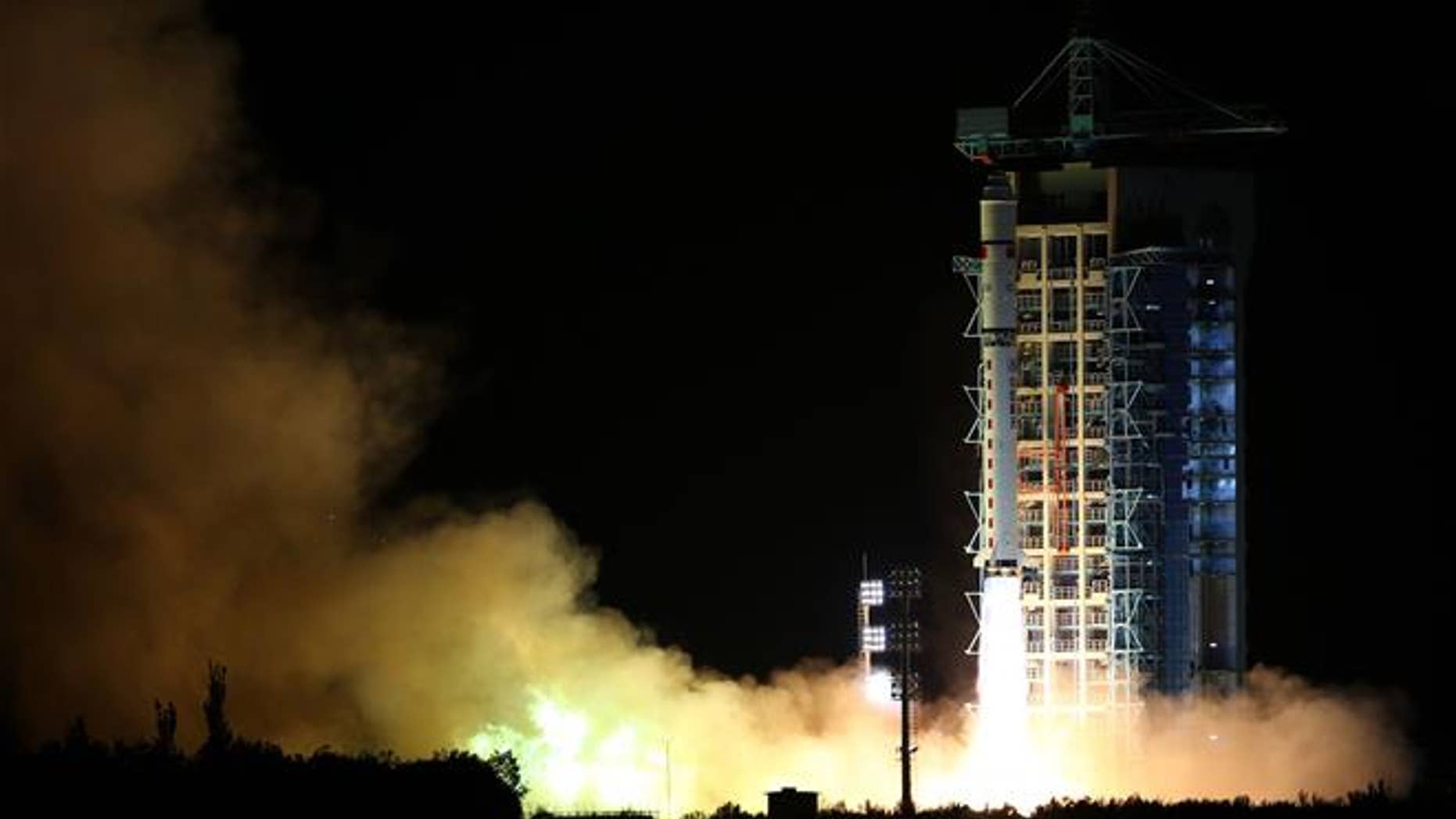 In this photo released by China's Xinhua News Agency, a rocket carrying the world's first quantum satellite lifts off from the Jiuquan Satellite Launch Center in Jiuquan in China's Gansu province on Aug. 16, 2016.