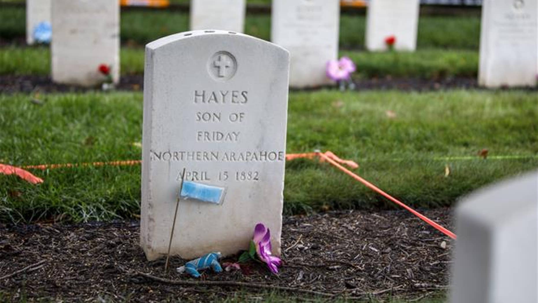 This Monday, Aug. 7, 2017 photo shows the headstone of Little Plume (aka Hayes Vanderbilt Friday), at Carlisle Barracks Cemetery in Carlisle, Pa.