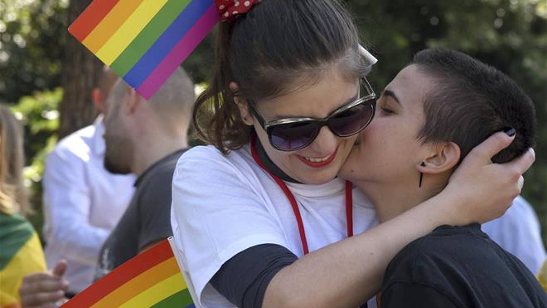 Women kiss during a gay pride march in Podgorica, Montenegro, on Sept. 23, 2017.