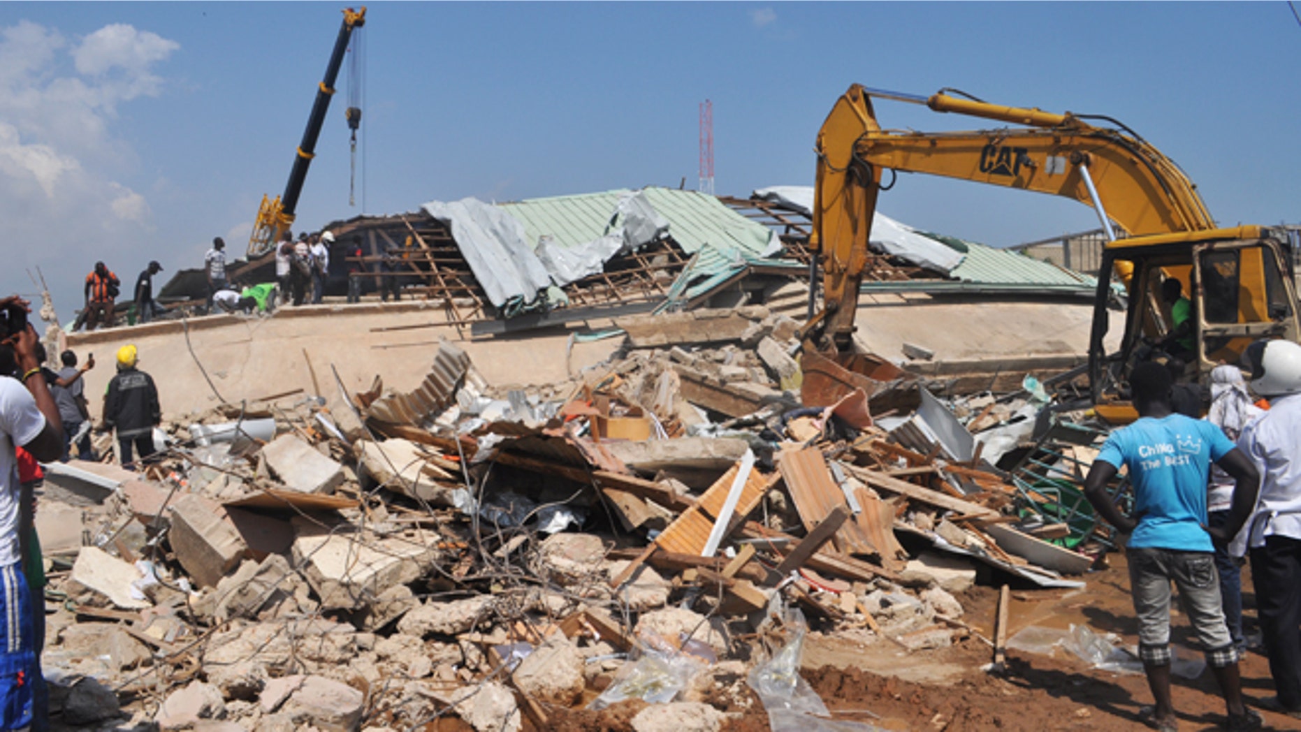 Nov. 7, 2012: Rescue workers toil among the remainder of a collapsed building in Accra, Ghana.