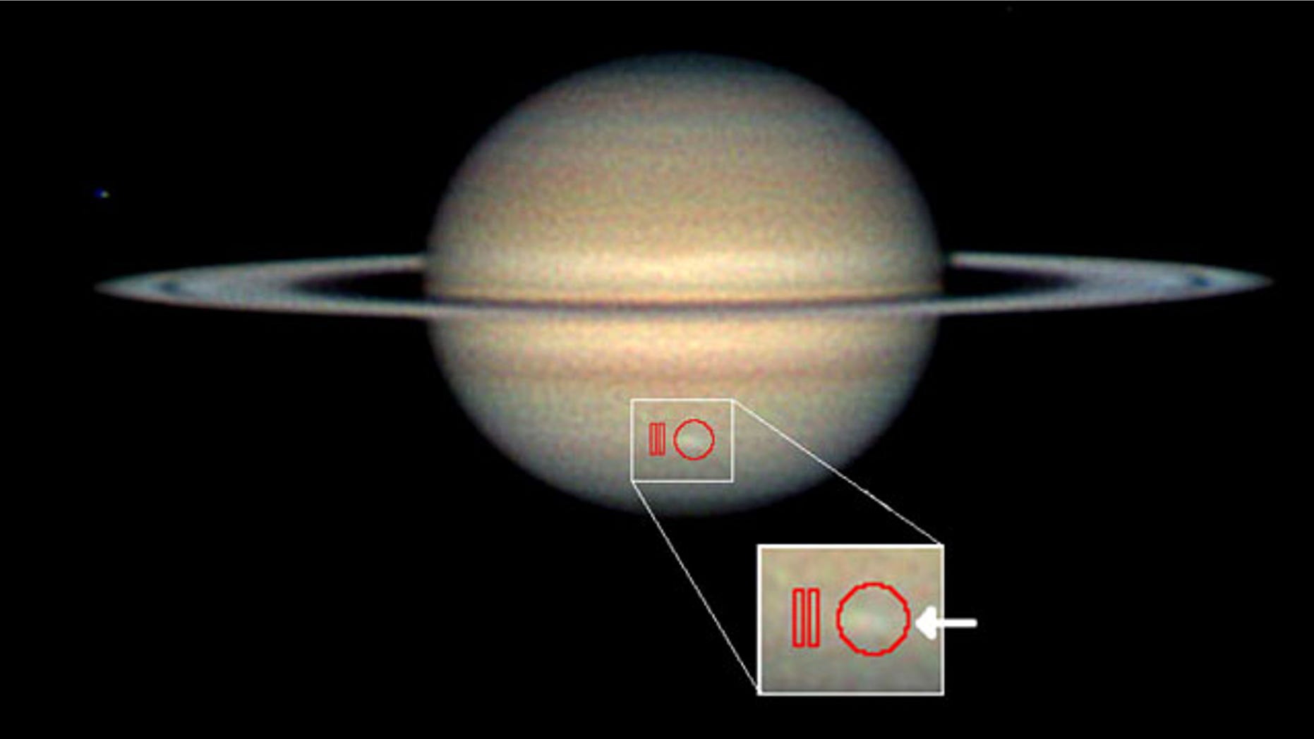 Amateur astronomer Christopher Go took this image of the storm on March 13, 2010. The arrow indicates the location of the storm and the red outlines show where Cassini's composite infrared spectrometer gathered data.
