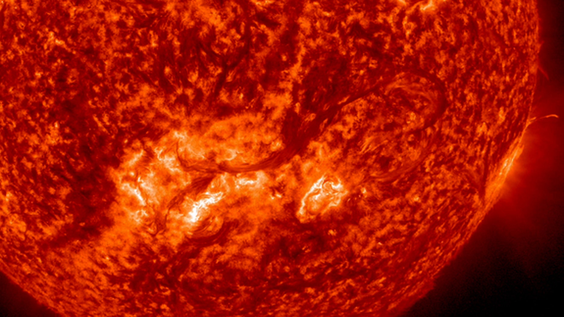 This image from NASA’s Solar Dynamics Observatory (SDO) shows a long, whip-like solar filament extending over 500,000 miles in a long arc above the sun’s surface between Aug. 6-8, 2012