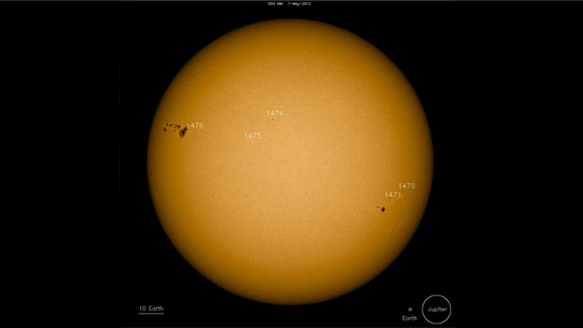 The monster sunspot group AR 1476 (upper left) measures more than 60,000 miles from end to end. NASA's Solar Dynamics Observatory spacecraft snapped this photo on May 7, 2012.