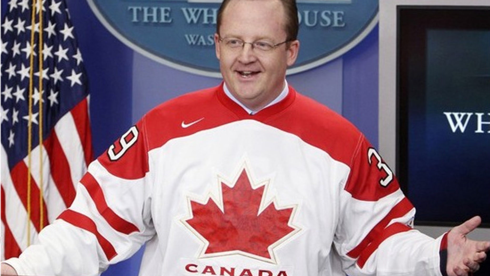Friday: White House Press Secretary Robert Gibbs dons the Canadian hockey team jersey from the Winter Olympics as part of his losing a bet on the game between Canada and the U.S. (AP).
