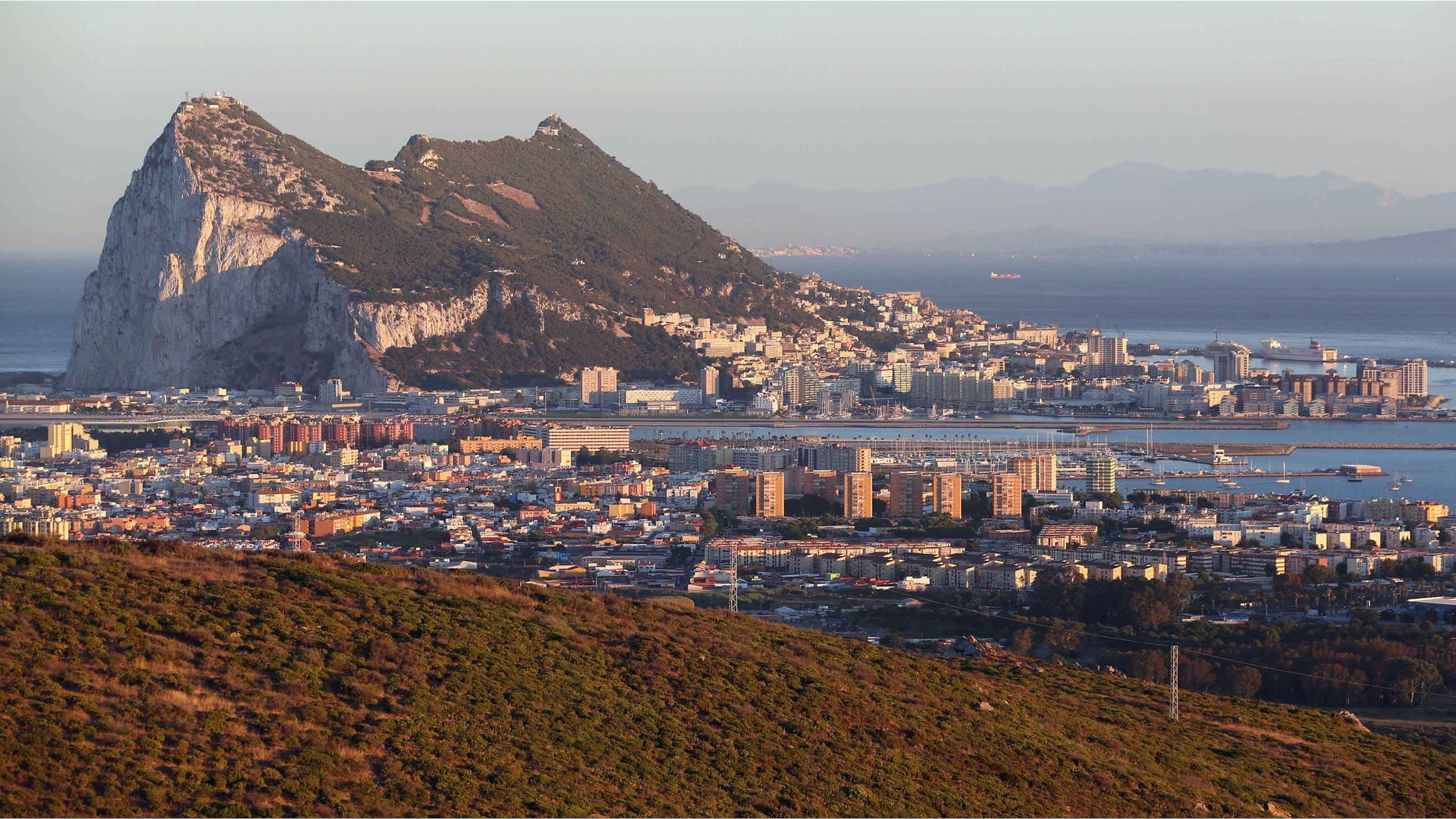 SAN ROQUE, SPAIN - AUGUST 07: The Rock of Gibraltar at dusk on August 7, 2013 in San Roque, Spain. David Cameron and his Spanish counterpart, Mariano Rajoy, Mr Rajoy offered to 'reduce measures' at the Gibraltar border. Tensions between the British and Spanish governments have been raised on issues surrounding the sovereignty of Gibraltar. An increase in Spanish border crossing checks between the Rock and mainland Spain, leading to lengthy queues, is widely considered to be a retaliatory move for the construction of an artificial reef in British waters, which it is claimed has had a negative impact on Spanish fishing vessels in the area. (Photo by Oli Scarff/Getty Images)