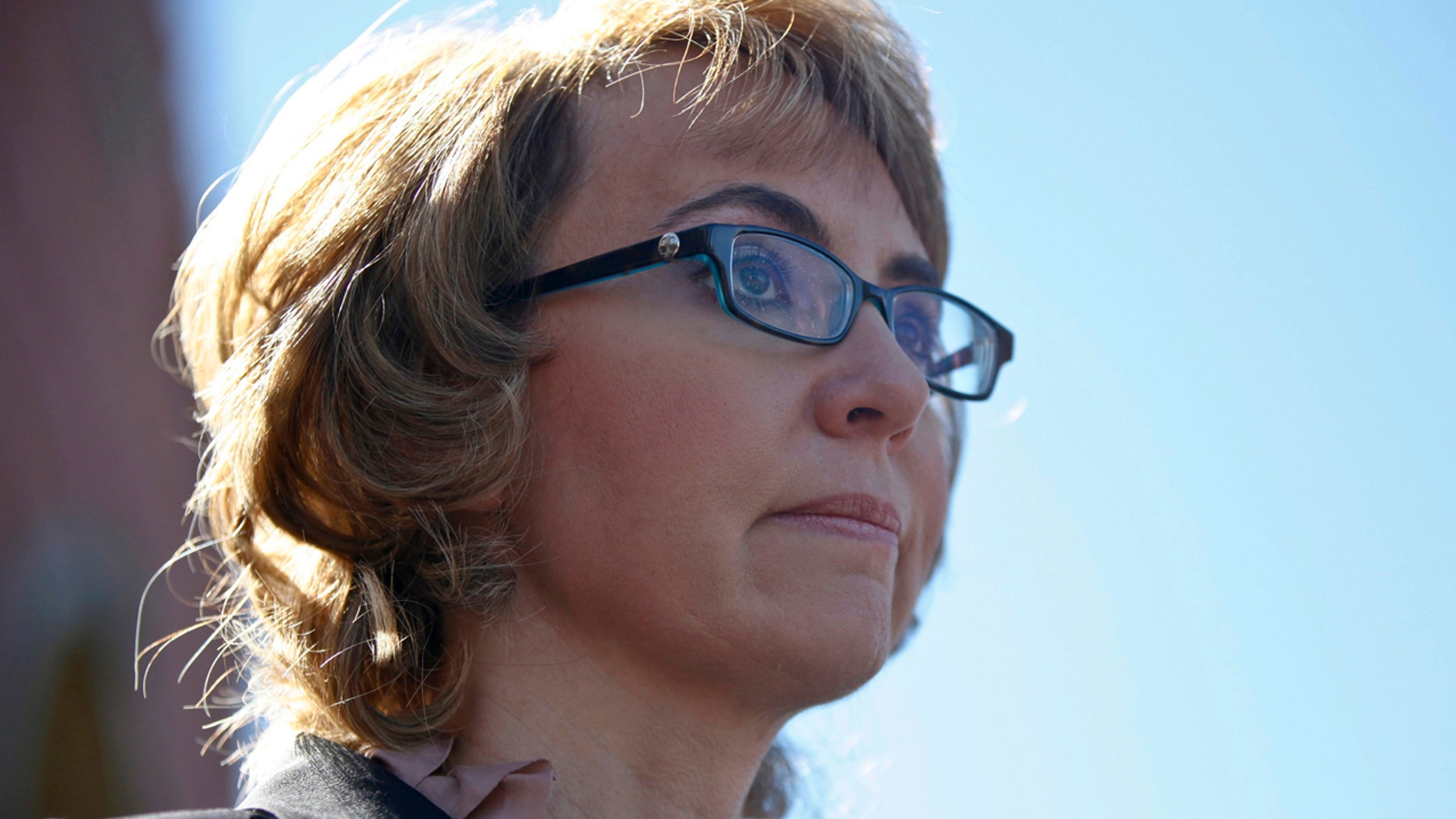 Former congresswoman Gabrielle Giffords addresses a news conference for victims of the January 8, 2011 Tucson shooting, at the Safeway grocery store parking lot where Giffords was shot during the incident in Tucson March 6, 2013.