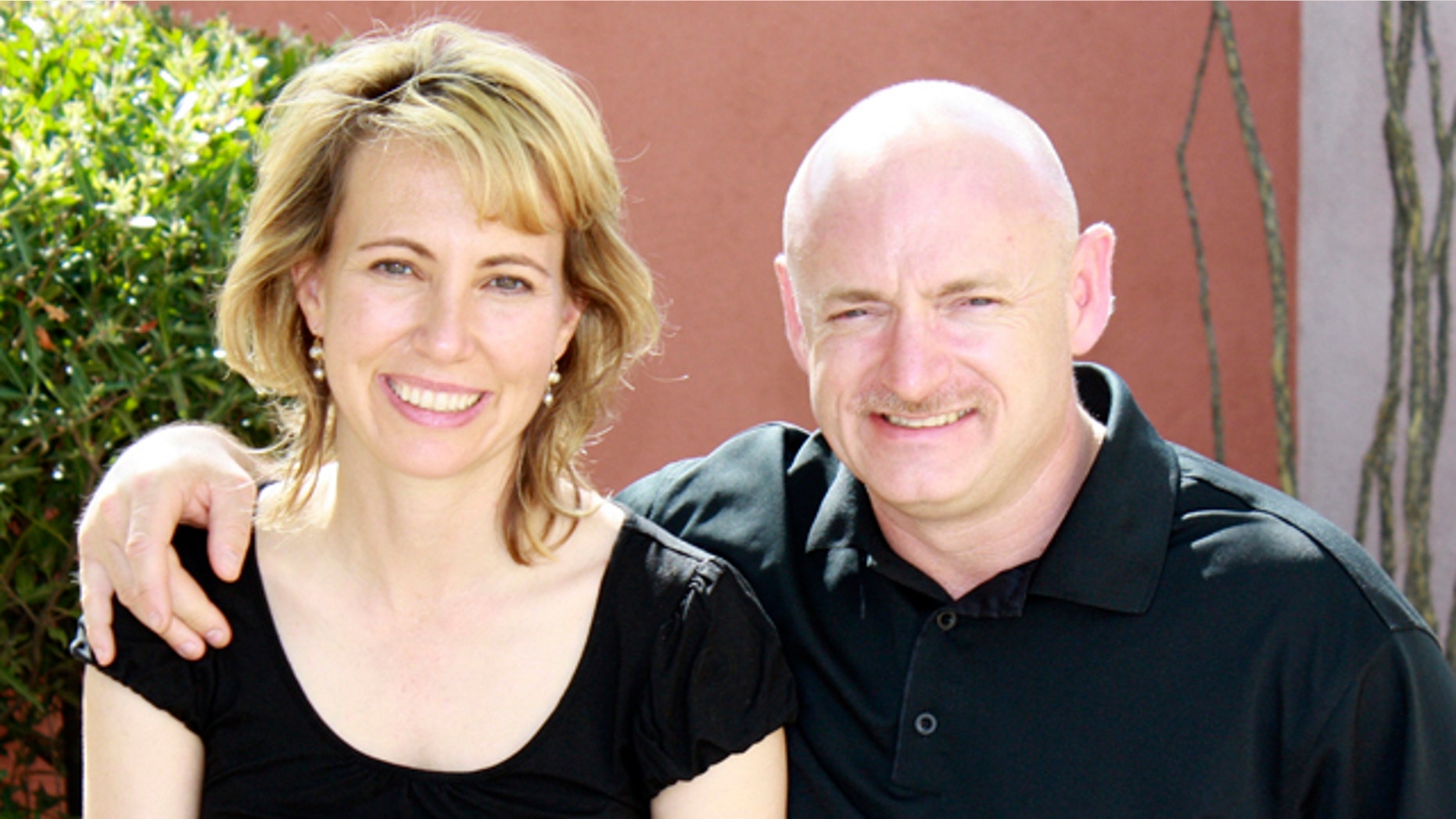 In this file photo provided by the office of Rep. Gabrielle Giffords, Giffords, left, is shown with her husband, NASA astronaut Mark Kelly.