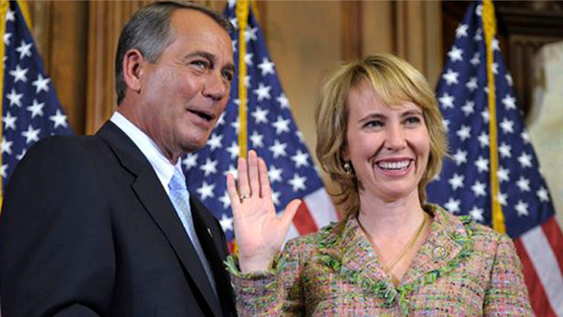 FILE - In this Jan. 5, 2011 file photo, House Speaker John Boehner reenacts the swearing in of Rep. Gabrielle Giffords, D-Ariz., on Capitol Hill in Washington. Congressional officials say Giffords has been shot in her district. (AP Photo/Susan Walsh, File)