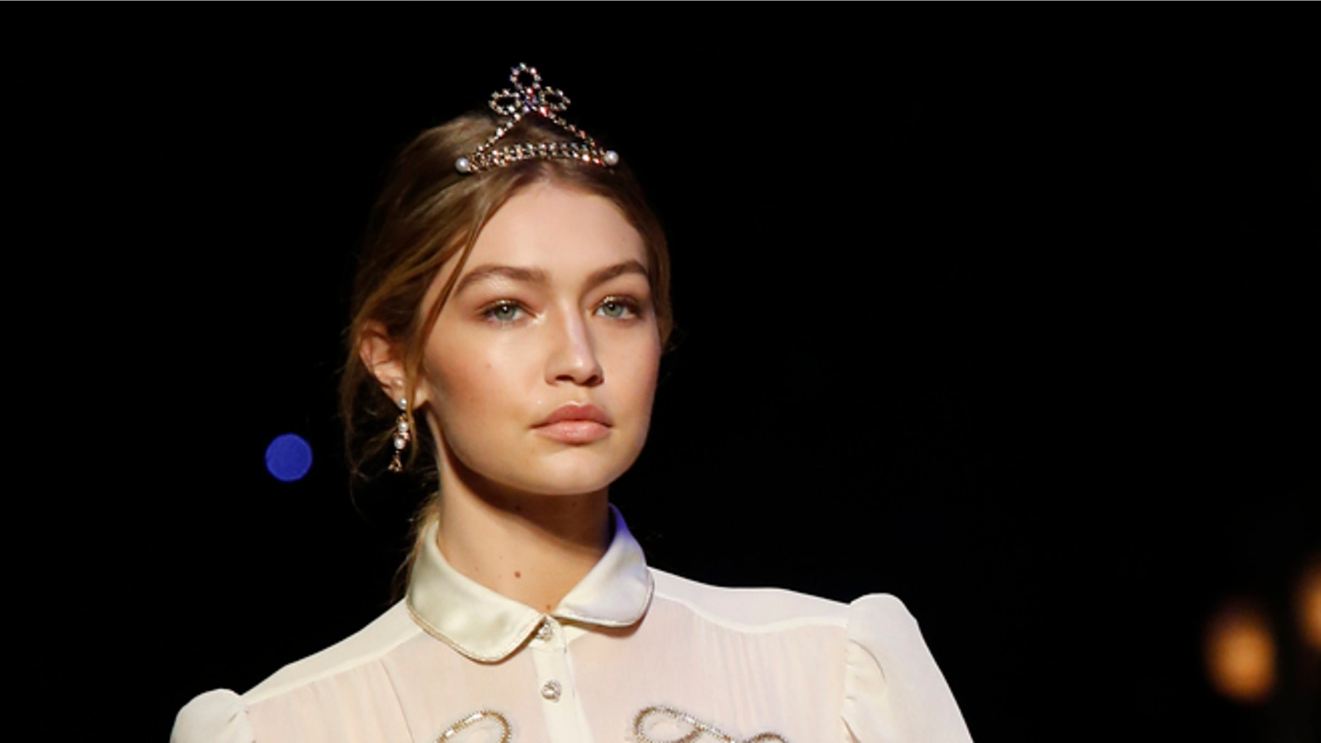 February 15, 2016. Model Gigi Hadid presents a creation from the Tommy Hilfiger Fall/Winter 2016 collection during New York Fashion Week.