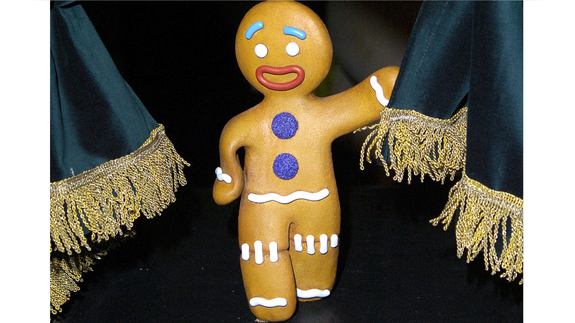 LONDON - NOVEMBER 21: A waxwork model of the children's story character the 'Gingerbread Man' goes on display alongside a seven foot tall waxwork figure of movie characture 'Shrek' at Madame Tussauds on November 21, 2007 in London, England. (Photo by Stuart Wilson/Getty Images)