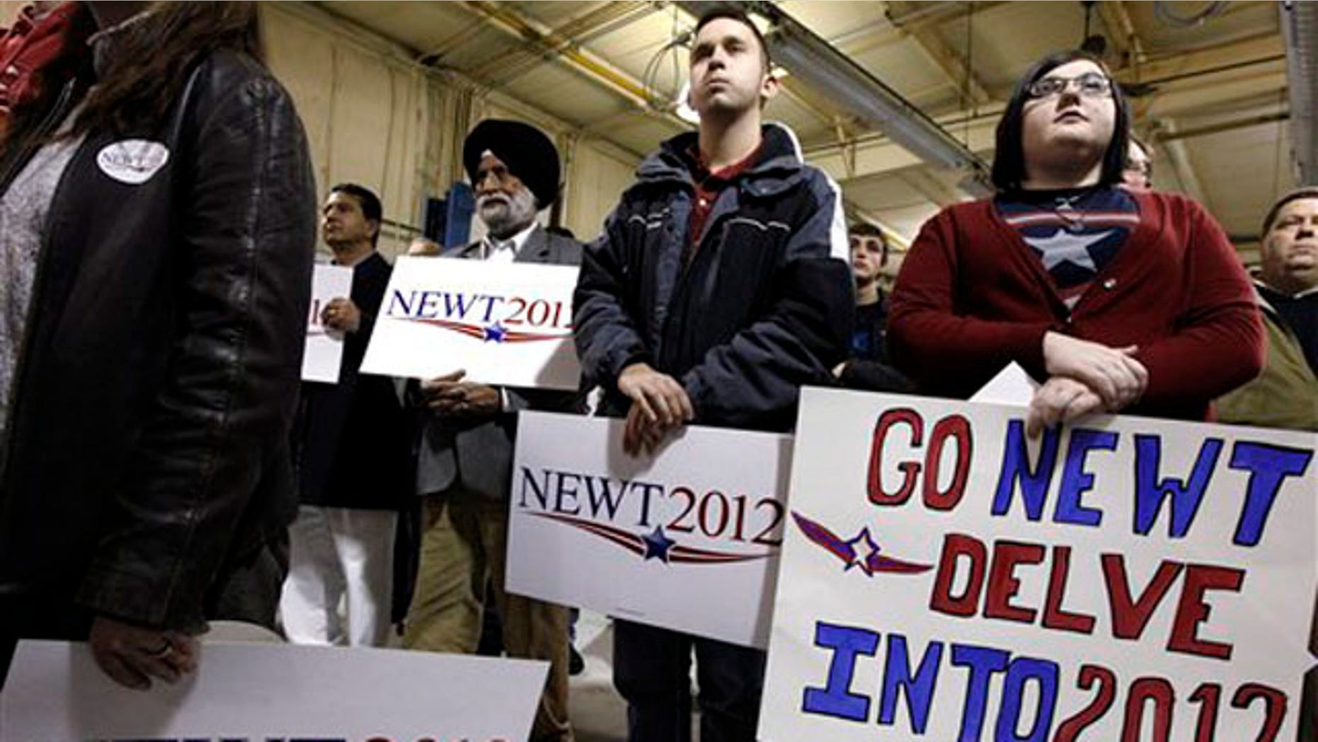 Jan. 2, 2012: Supporters watch as Newt Gingrich speaks at his campaign headquarters in Davenport, Iowa.