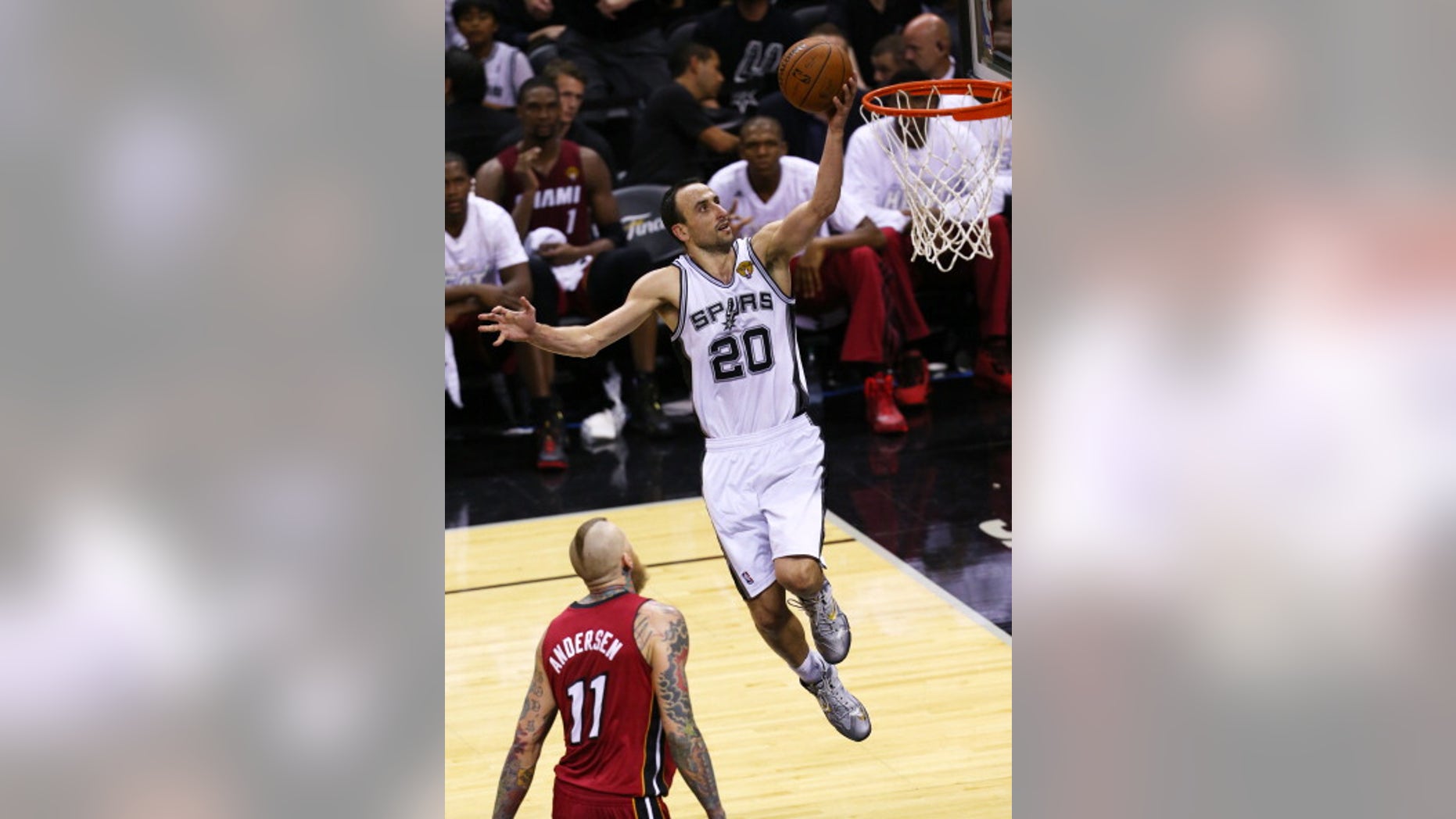 SAN ANTONIO, TX - JUNE 5: Manu Ginobili #20 of the San Antonio Spurs shoots a layup over Chris Andersen #11 of the Miami Heat in Game One of the 2014 NBA Finals.