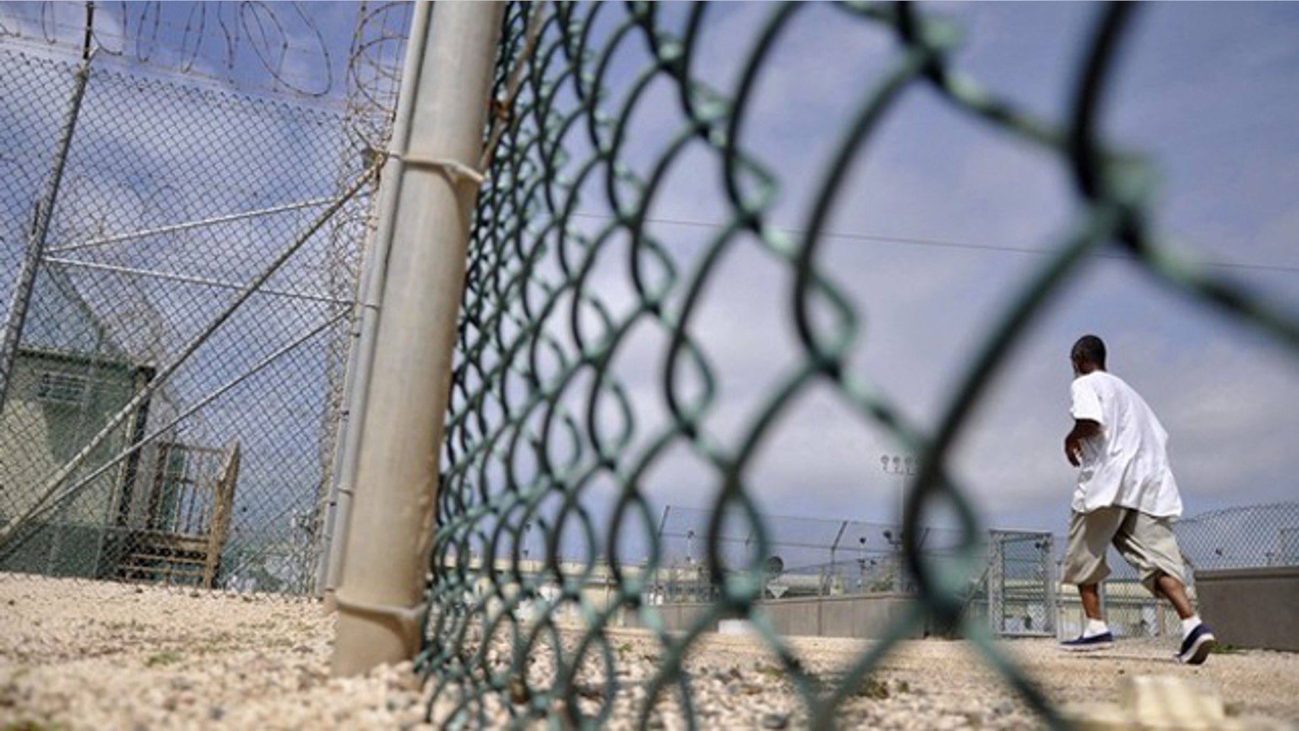 In this April 27, 2010 photo, a detainee runs inside an exercise area at the detention facility at Guantanamo Bay.