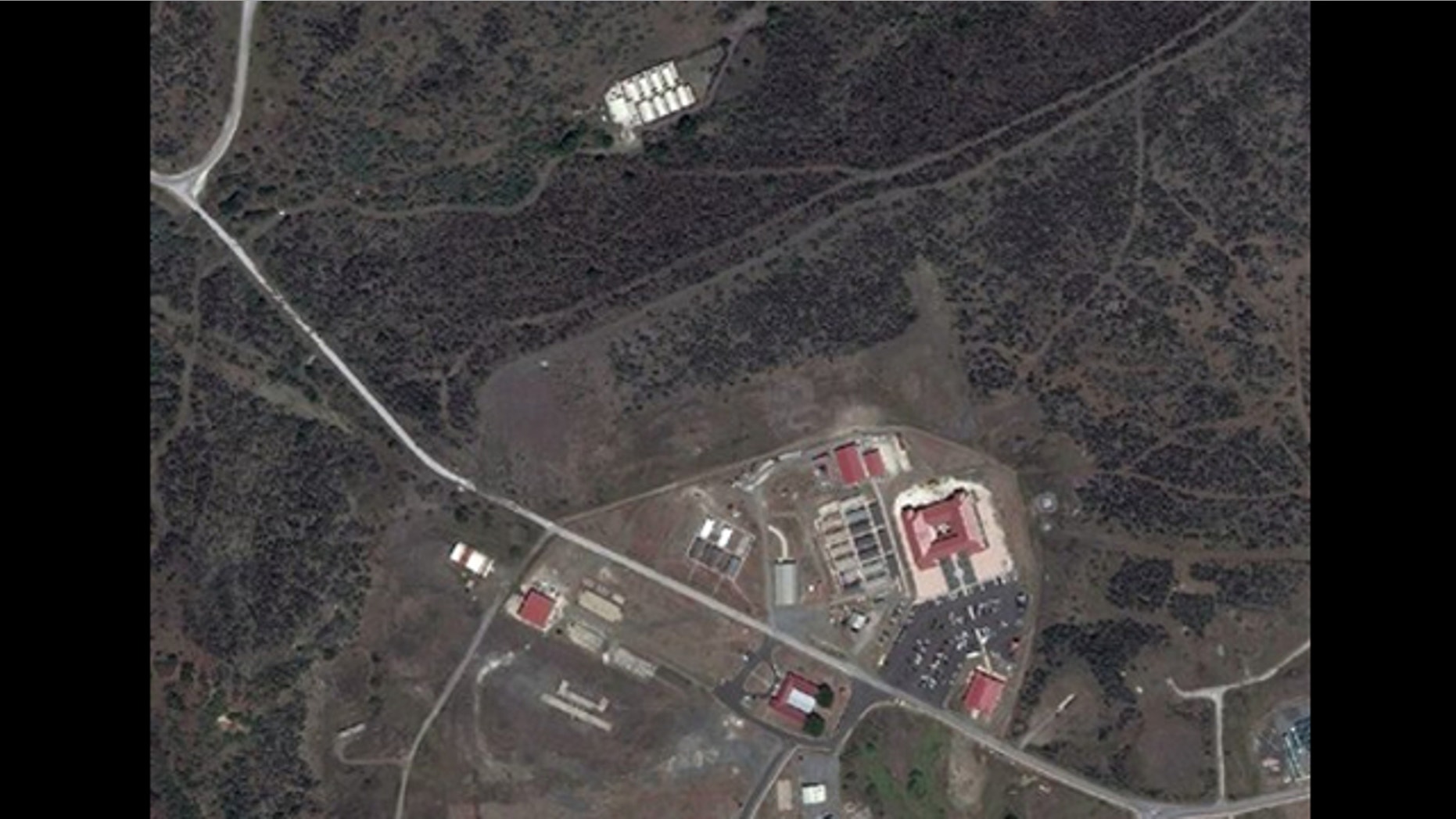 FILE: Sept. 2, 2010: This satellite image provided by TerraServer.com and DigitalGlobe shows a portion of Naval Station Guantanamo Bay, Cuba, including the secret facility known as Penny Lane, upper in white.