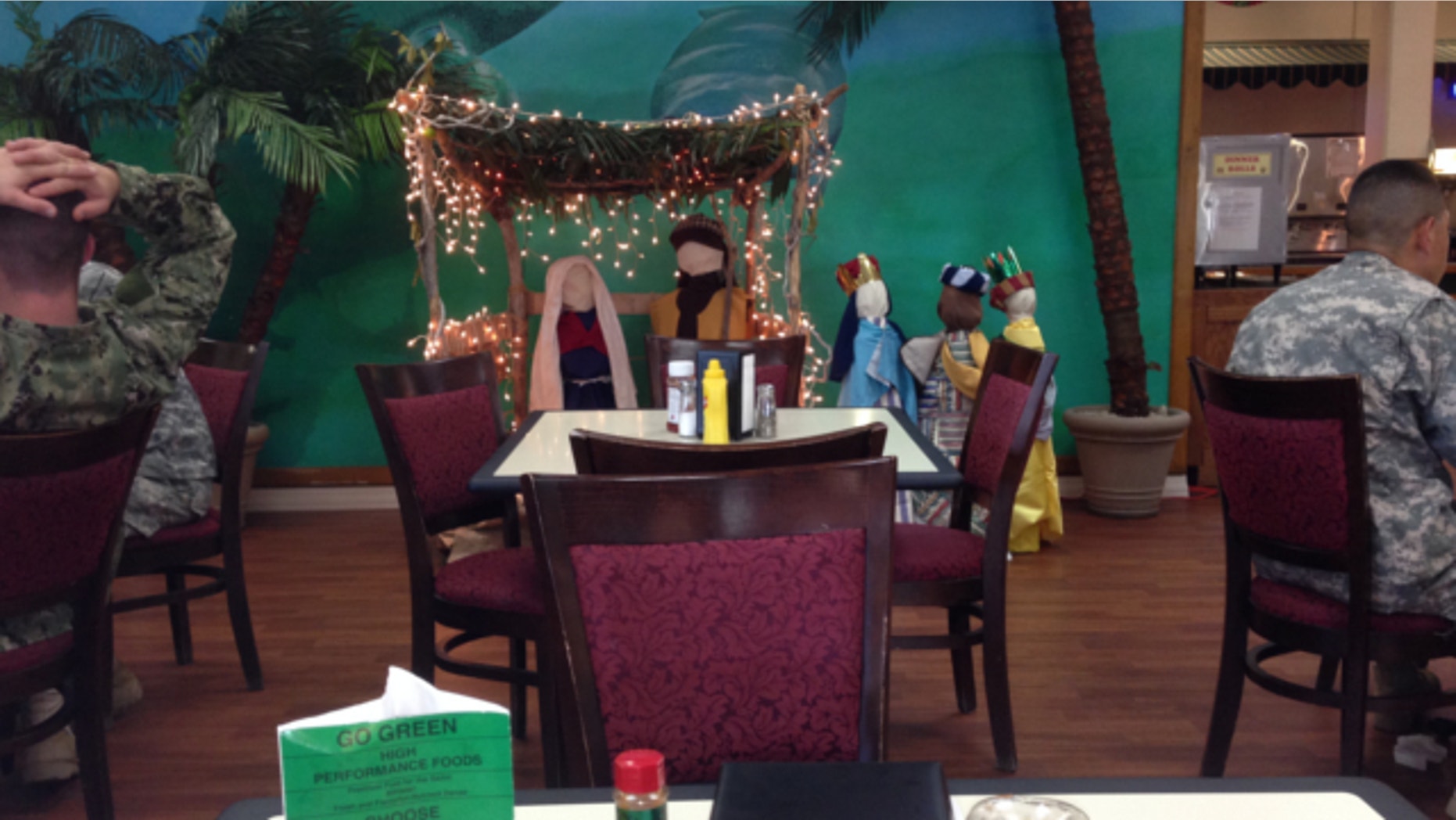 Dec, 18, 2013: Troops eat lunch near a nativity scene at the Guantanamo Bay naval base.