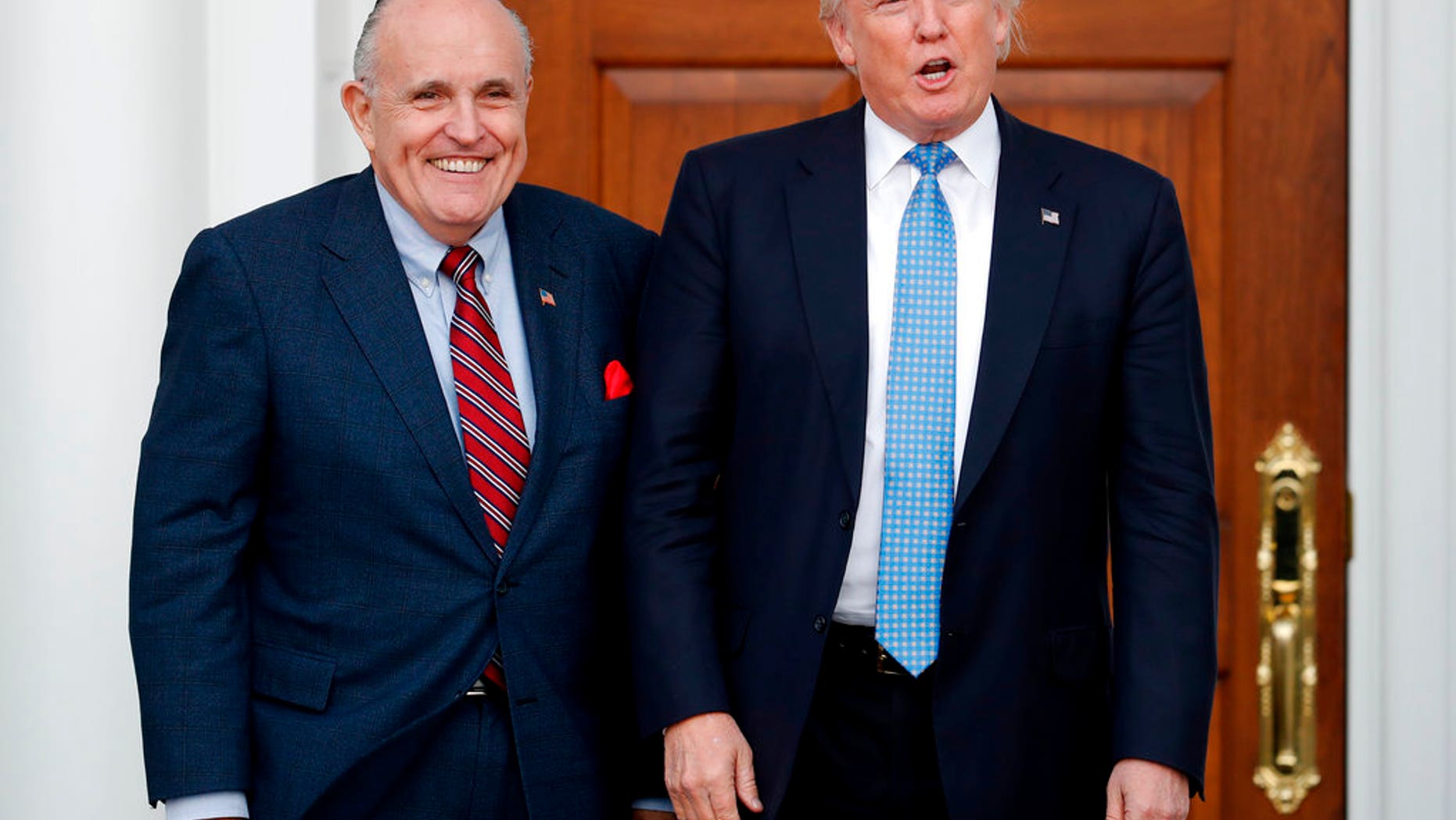 FILE - In this Nov. 20, 2016, file photo, then-President-elect Donald Trump, right, and former New York Mayor Rudy Giuliani pose for photographs as Giuliani arrives at the Trump National Golf Club Bedminster clubhouse in Bedminster, N.J. Giuliani is joining the legal team defending President Donald Trump in the special counselâs Russia investigation. Thatâs according to a statement from Trump personal attorney Jay Sekulow. (AP Photo/Carolyn Kaster, File)