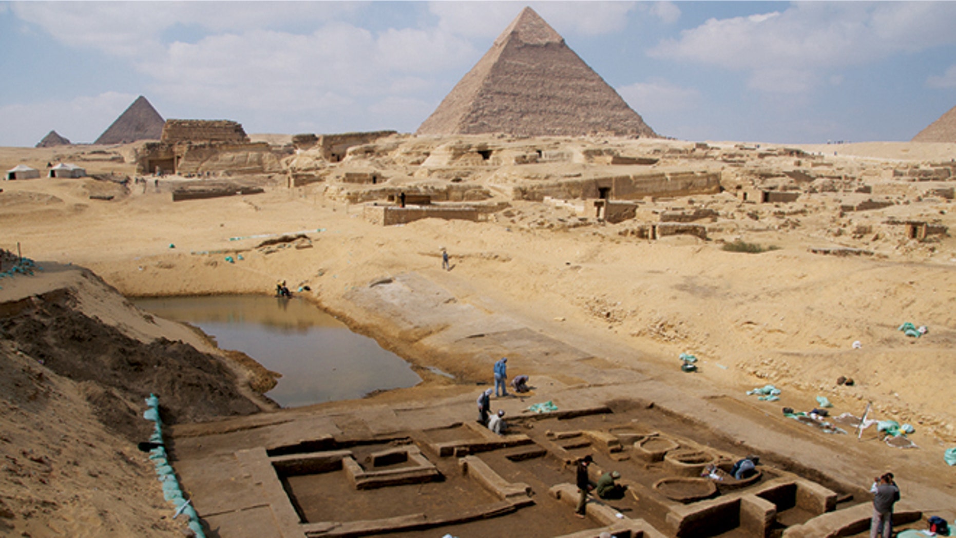 Archaeologists working at the Giza Pyramids have made several new discoveries that shed light on life at the time the pyramids were built. Among the discoveries is a basin that may have been part of a thriving harbor and a "silo building complex," where researchers have found numerous bones from the forelimbs of cattle, offerings in ancient Egypt, suggesting royal cult priests perhaps venerating the pharaoh Khafre occupied the complex.
