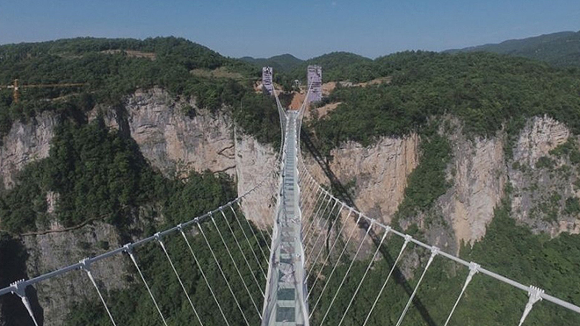The world’s longest and highest glass bottom bridge above the Zhangjiajie Grand Canyon, in the central Hunan province, was shut down after tens of thousands of tourists traversed the span every day.