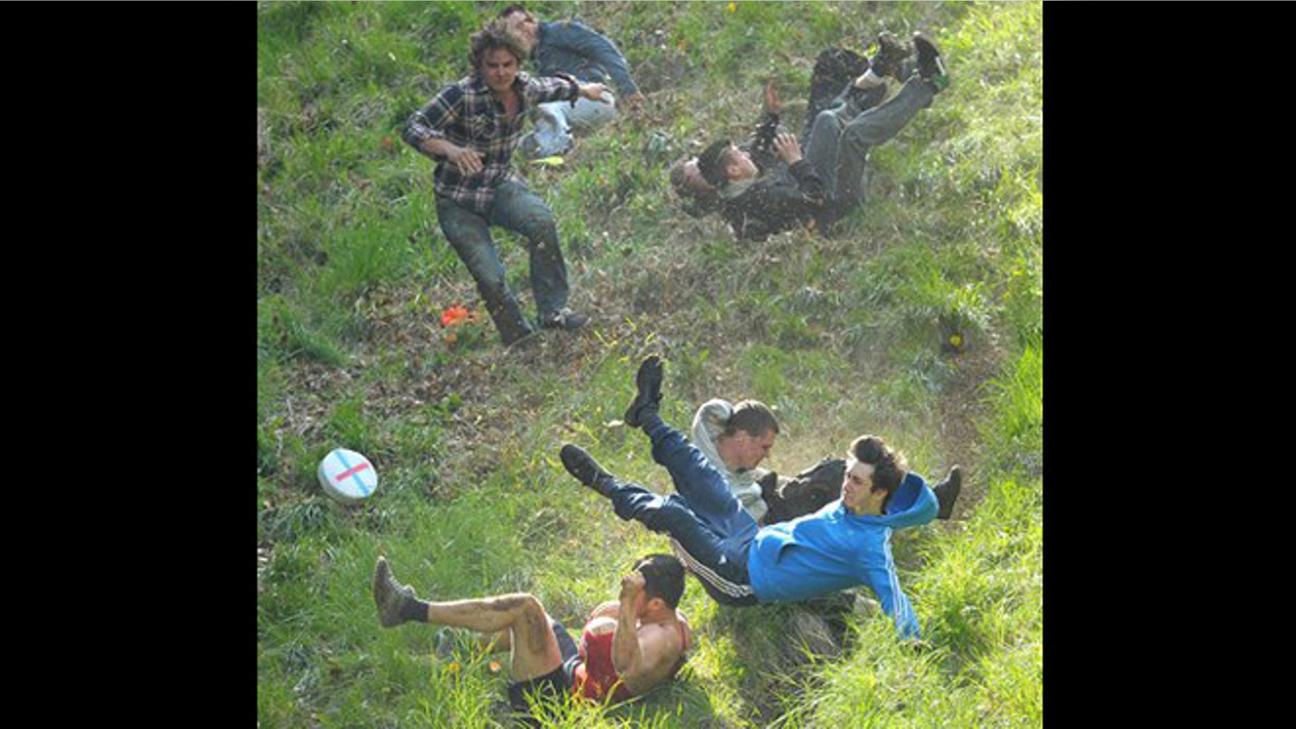 May 27, 2013: Competitors take part in the annual Cheese Rolling event at Coppers Hill near Brockworth, Gloucestershire, England.