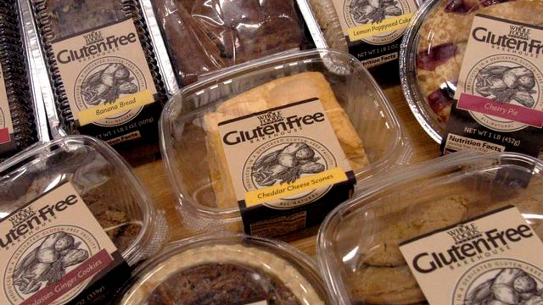 ** FILE ** A sample of some of the 27 gluten-free products are displayed, in this Oct. 5, 2004 file photo, at the Whole Foods Market Gluten-Free Bakehouse in Morrisville, N.C. Each label reads "Produced in a Dedicated Gluten-Free Facility." Once banished to the dusty bottom shelves of obscure grocers, the gluten-free revolution is surfacing in the aisles of major supermarkets. (AP Photo/Karen Tam)