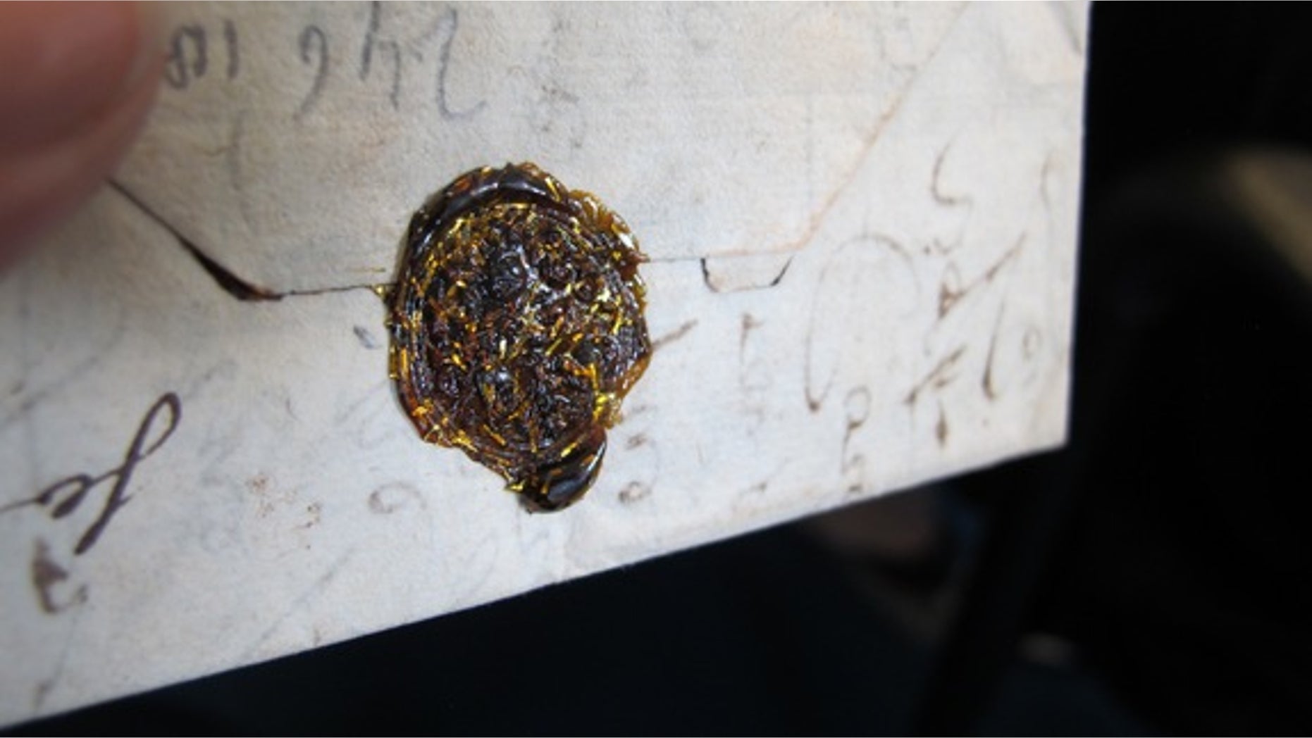 The Brienne trunk contained hundreds of unopened letters. Thie one features a gold wax seal.