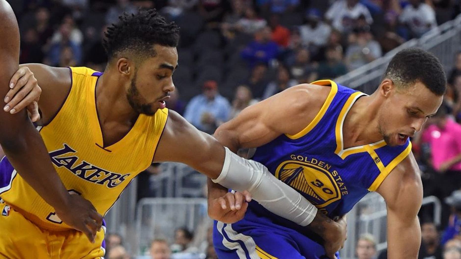 LAS VEGAS, NV - OCTOBER 15: Stephen Curry #30 of the Golden State Warriors steals the ball from D'Angelo Russell #1 of the Los Angeles Lakers during their preseason game at T-Mobile Arena on October 15, 2016 in Las Vegas, Nevada. Golden State won 112-107. NOTE TO USER: User expressly acknowledges and agrees that, by downloading and or using this photograph, User is consenting to the terms and conditions of the Getty Images License Agreement. (Photo by Ethan Miller/Getty Images)