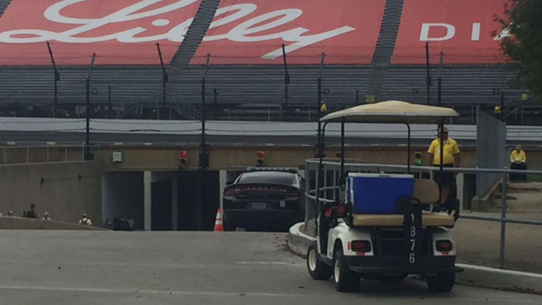 A golf cart struck several pedestrians attending the Brickyard 400 Sunday.