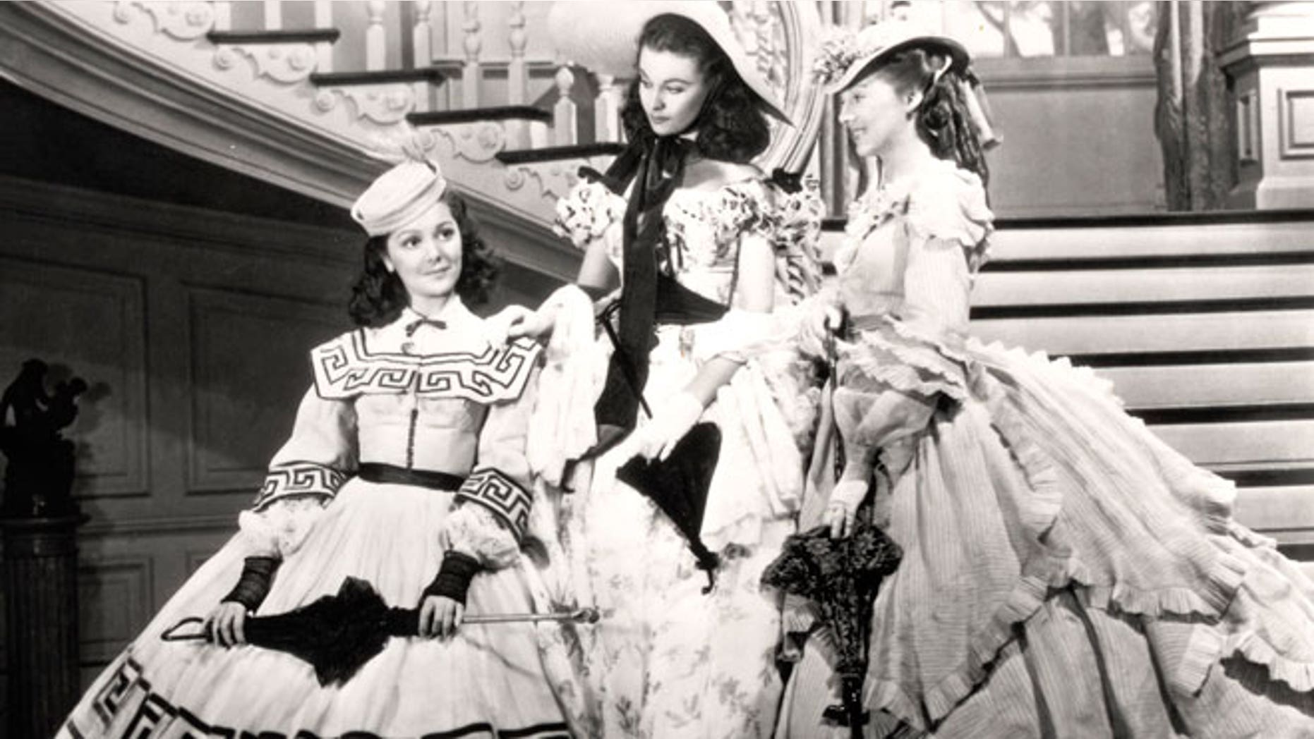 This undated image from the film "Gone with the Wind" provided by New Line Cinema shows, from left, Ann Rutherford, Vivien Leigh and Evelyn Keyes.
