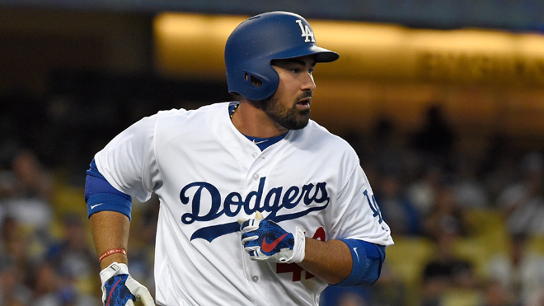 LOS ANGELES, CA - APRIL 15: Adrian Gonzalez #42 of the Los Angeles Dodgers runs to first base after hitting a single in the first inning against the San Francisco Giants at Dodger Stadium on April 15, 2016 in Los Angeles, California. (Photo by Lisa Blumenfeld/Getty Images)