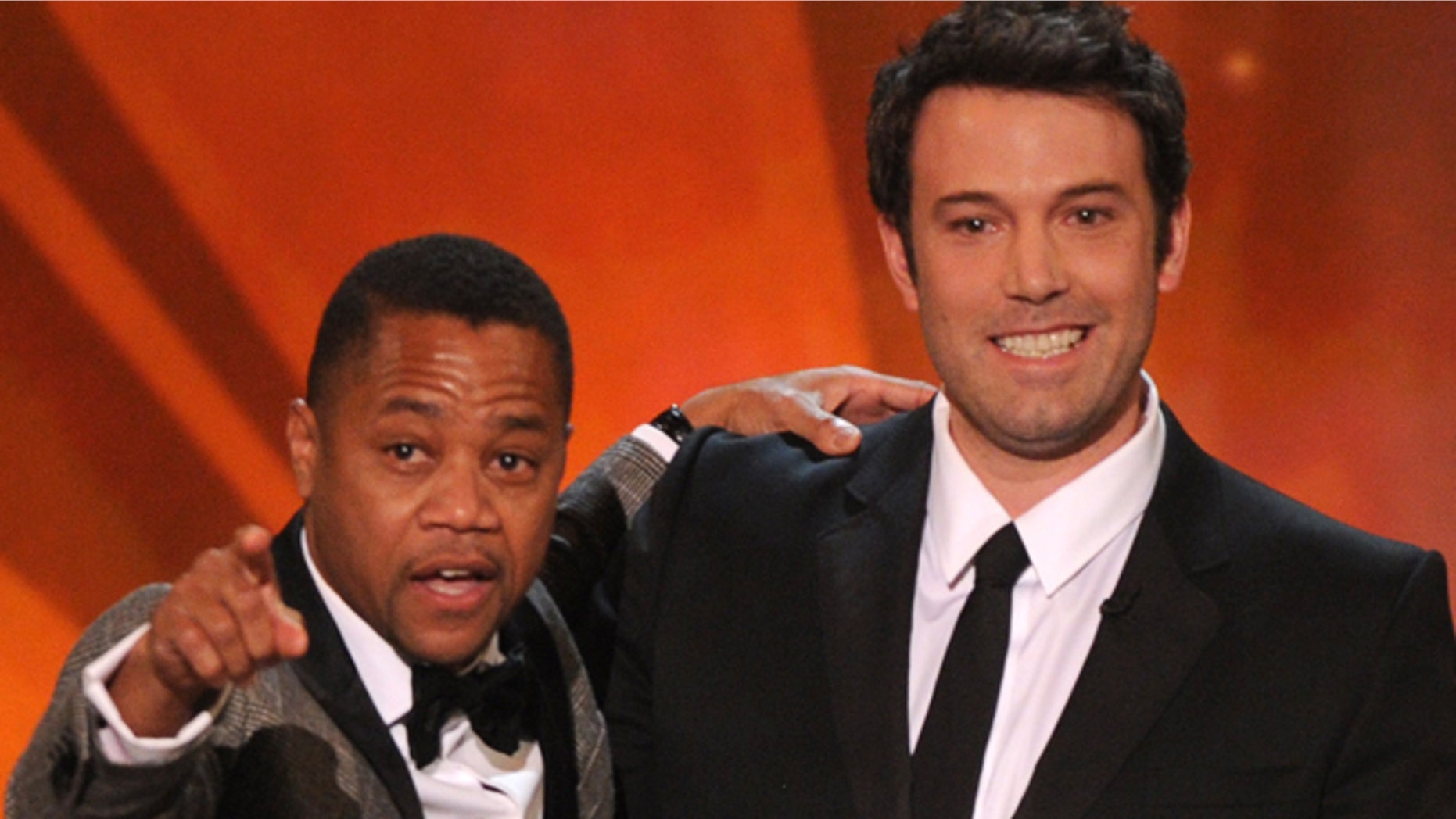 CORRECTS PERSON AT LEFT TO CUBA GOODING JR- Cuba Gooding, Jr, , left, and Ben Affleck speak on stage at the 20th annual Screen Actors Guild Awards at the Shrine Auditorium on Saturday, Jan. 18, 2014, in Los Angeles. (Photo by Frank Micelotta/Invision/AP)
