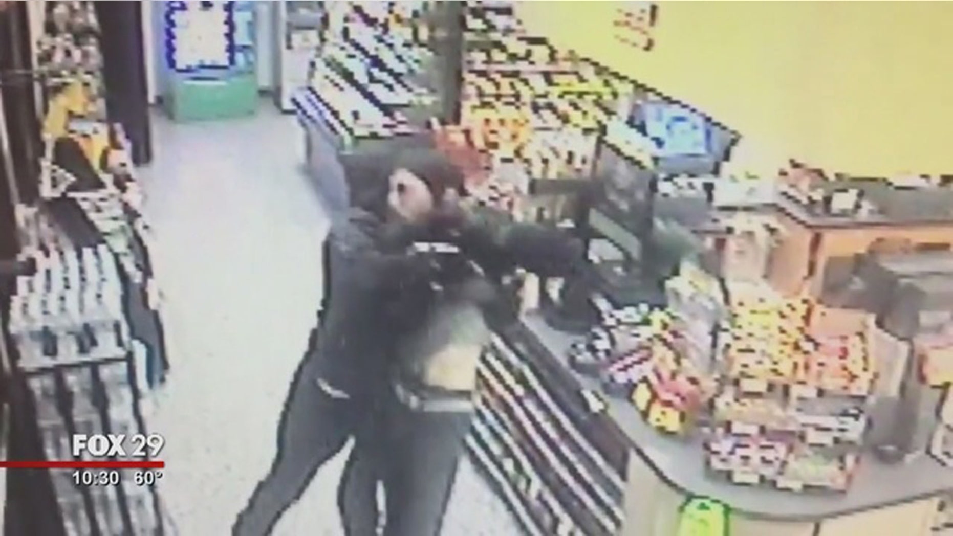 A Good Samaritan was captured via surveillance video fighting an armed man who police say robbed a Wawa store.