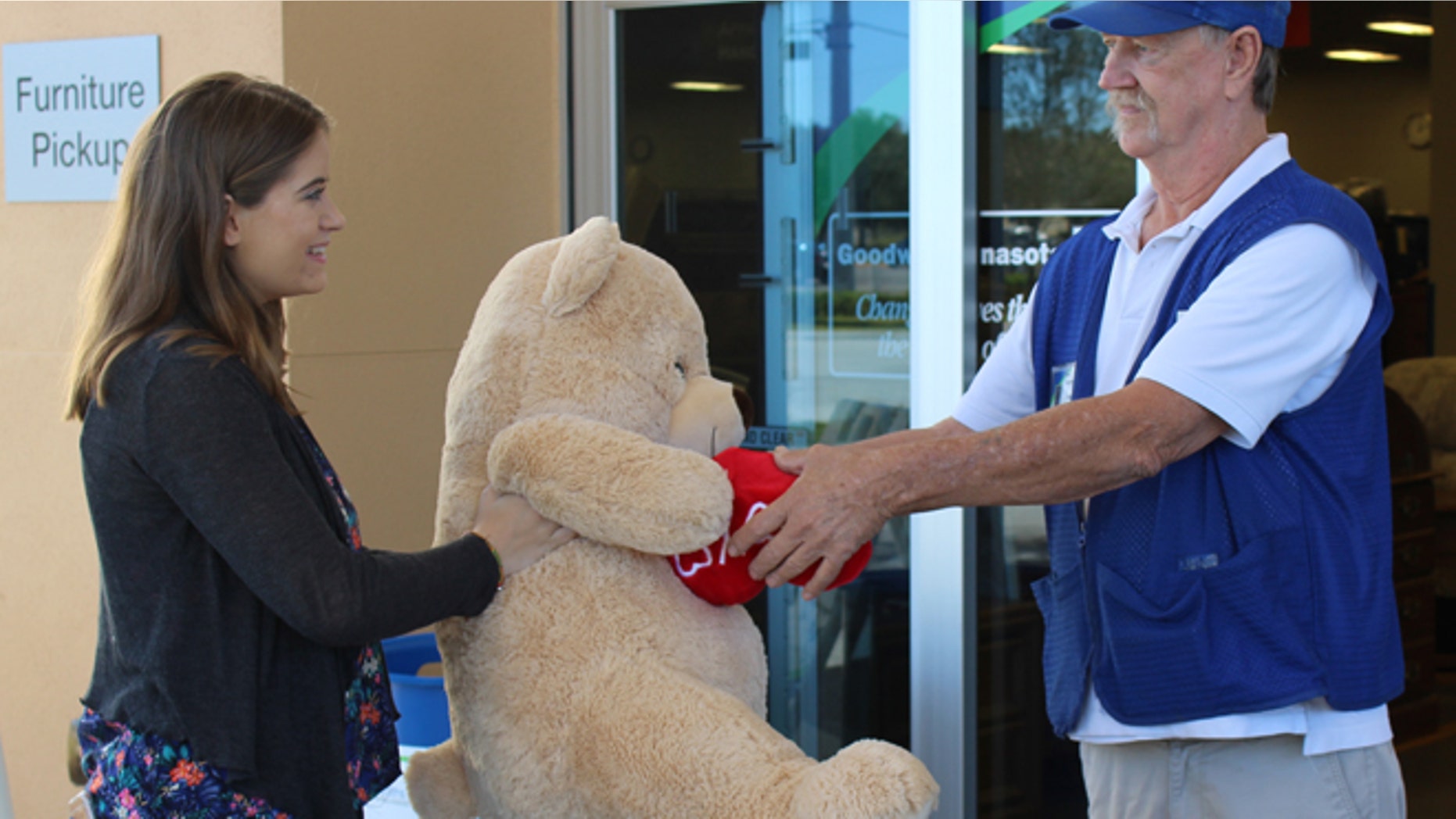 Amanda Emory drops off a giant Valentine’s Day teddy bear from her ex-boyfriend to Goodwill Manasota's Tom Lohr. (Goodwill Manasota)