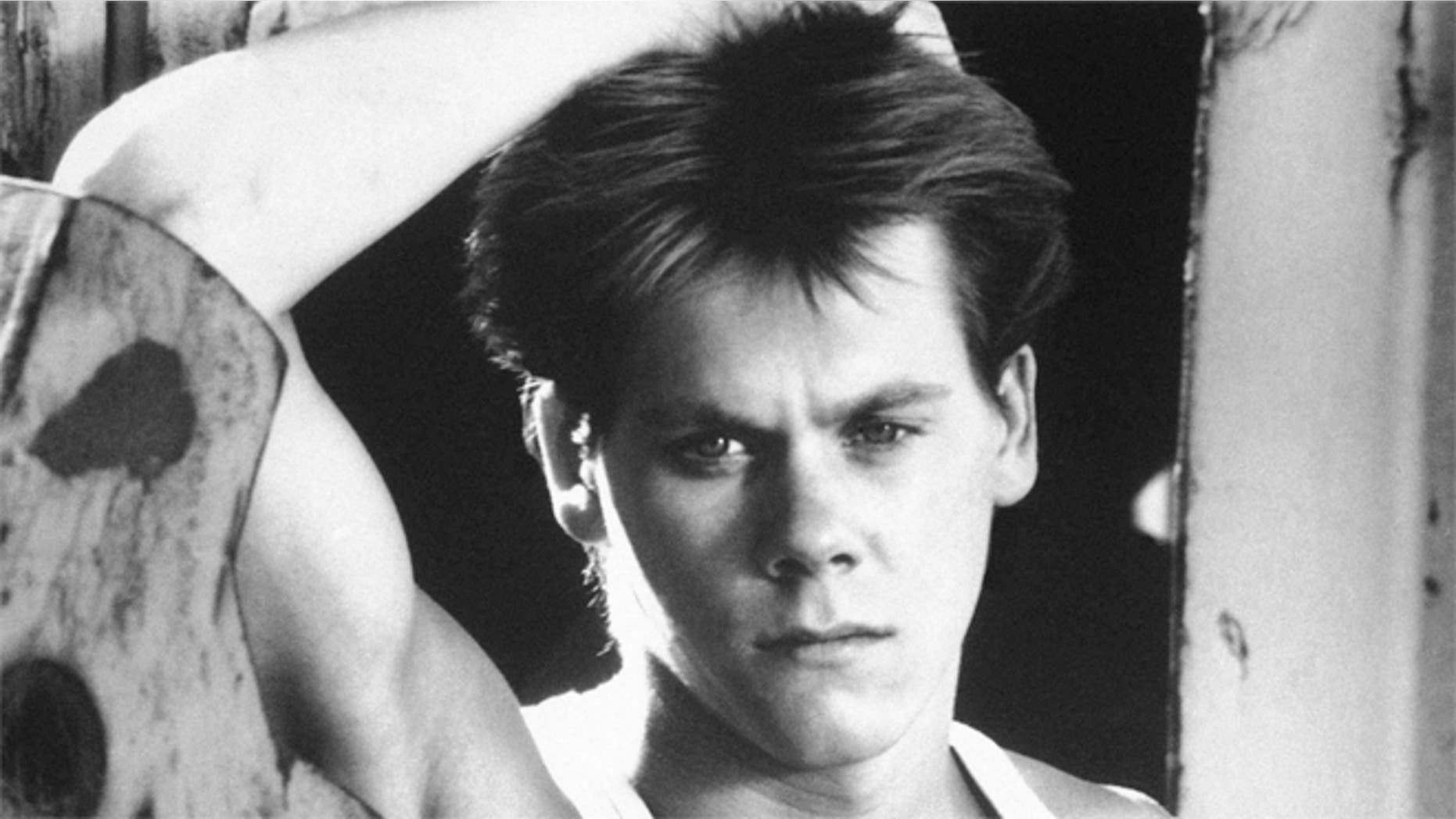 Kevin Bacon is shown in a scene from the movie "Footloose."