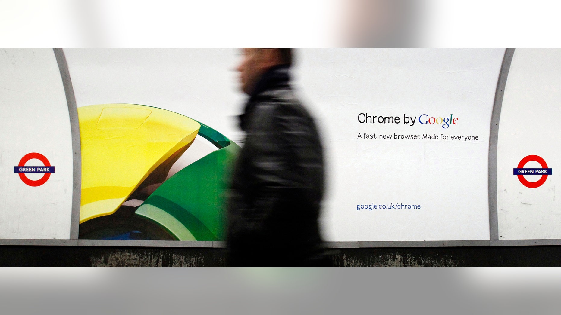 File photo - A man walks past a poster for Google's Chrome browser in an underground station in central London Jan. 25, 2010. (REUTERS/Luke MacGregor)