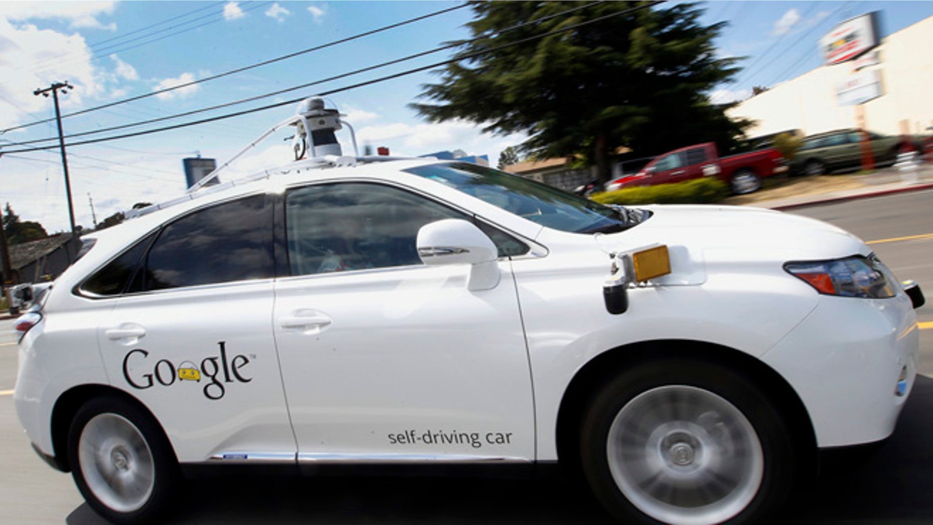 May 13, 2015: Google's self-driving Lexus car drives along street during a demonstration at Google campus in Mountain View, Calif.