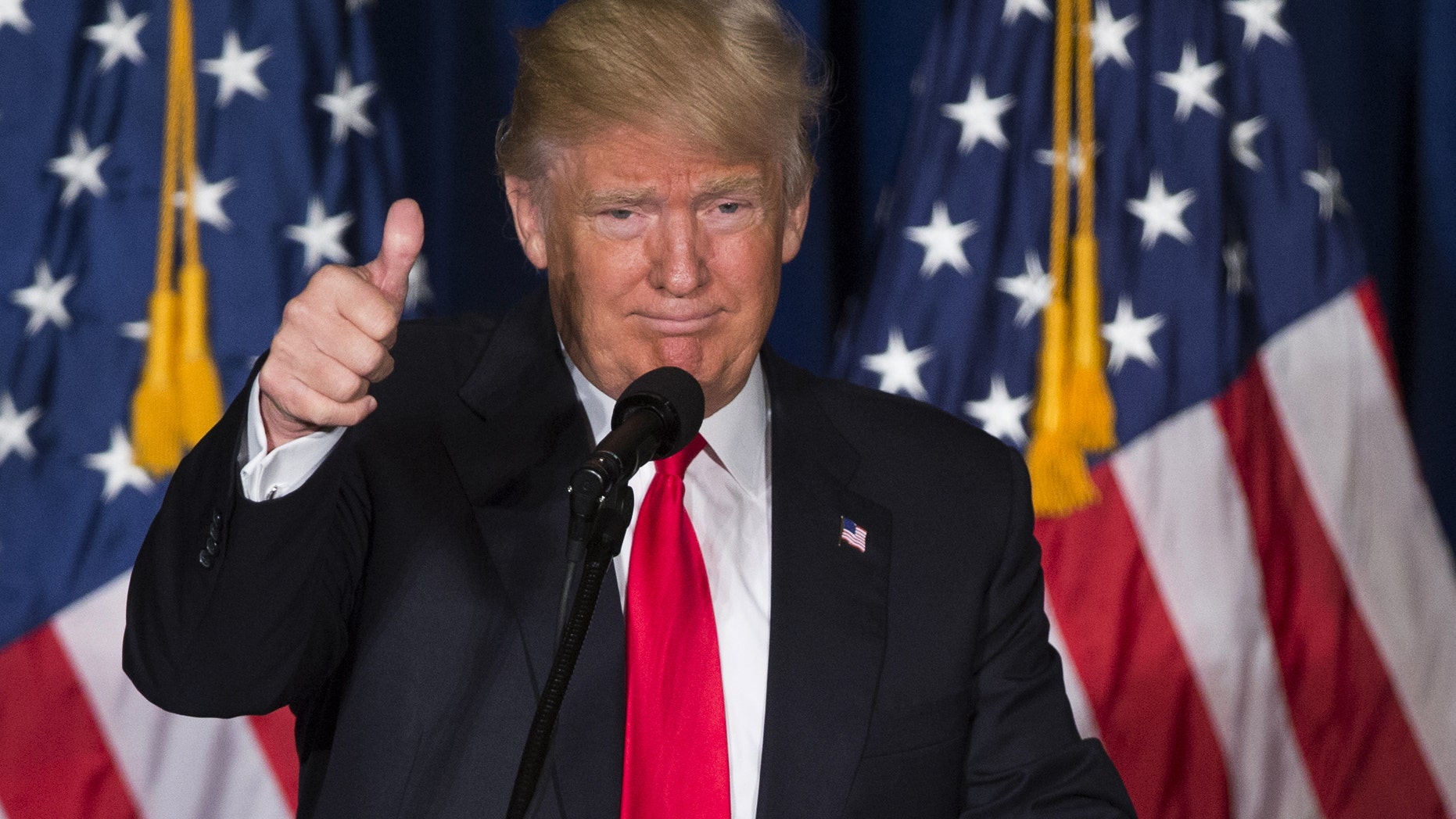 FILE -- April 27, 2016: Republican presidential candidate Donald Trump gives a thumbs up after giving a foreign policy speech at the Mayflower Hotel in Washington. (AP Photo/Evan Vucci)