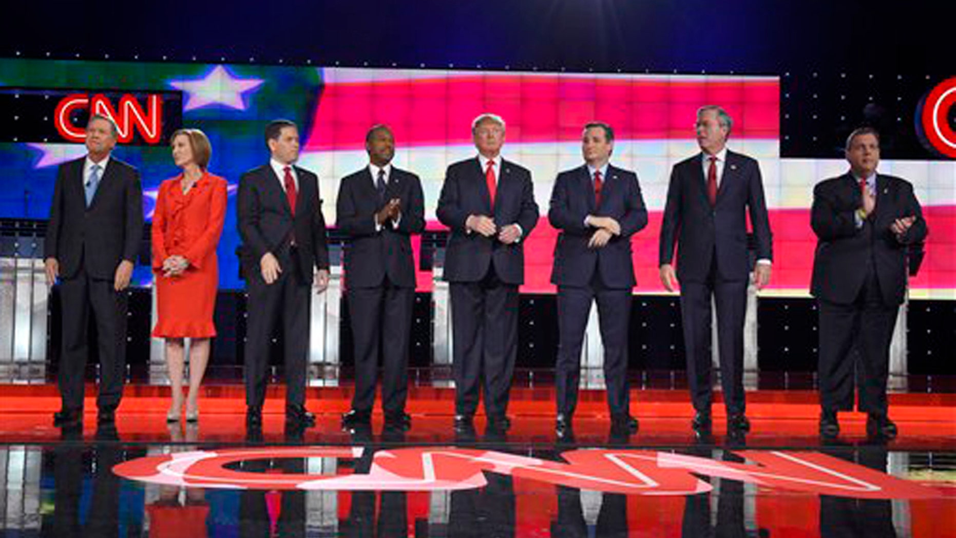 Republican presidential candidates, from left, John Kasich, Carly Fiorina, Marco Rubio, Ben Carson, Donald Trump, Ted Cruz, Jeb Bush, Chris Christie, and Rand Paul take the stage during the CNN Republican presidential debate at the Venetian Hotel & Casino on Tuesday, Dec. 15, 2015, in Las Vegas. (AP Photo/Mark J. Terrill)