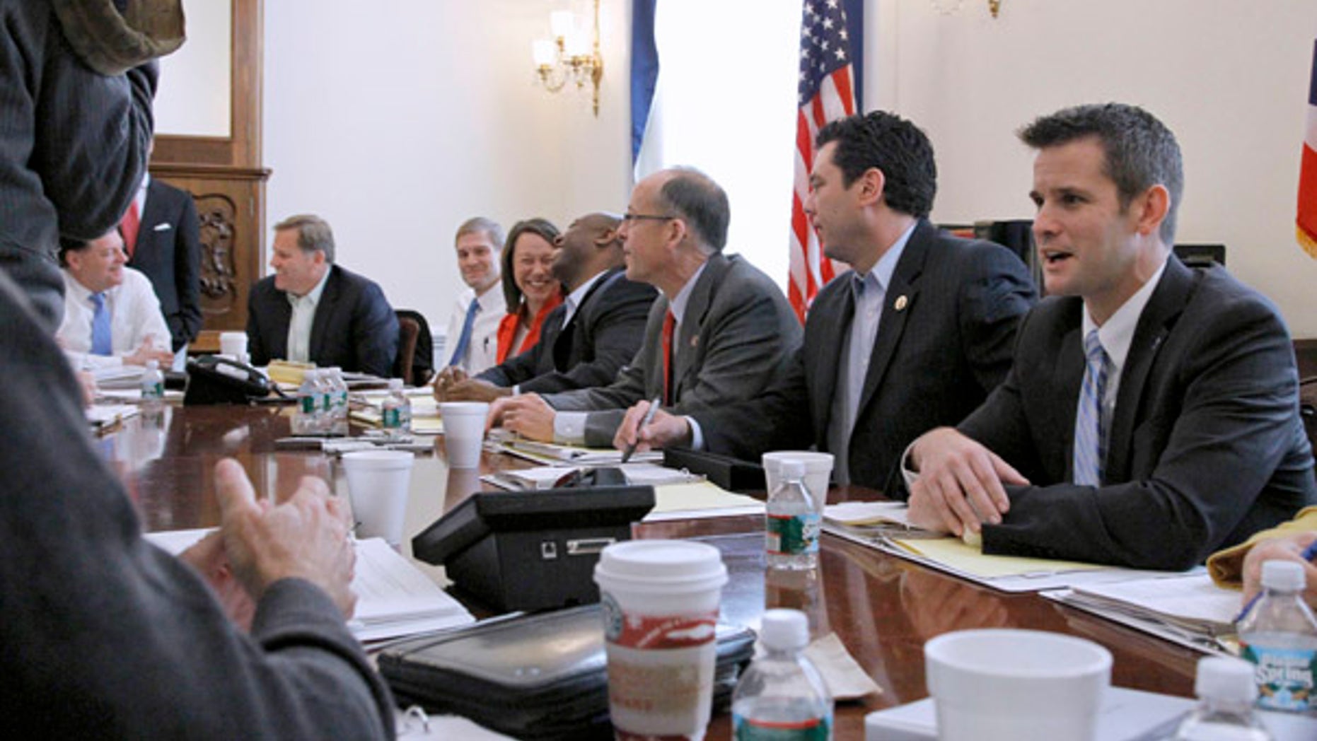 Nov. 9: Republican Majority Transition team members, from left, Rep. Tom Cole, R-Okla.; Rep. Mike Rogers, R-Mich.; Rep. Jim Jordan, R-Ohio, Rep.-elect Martha Roby, R-Ala.; Rep.-elect Tim Scott, R-S.C.; chairman Rep. Greg Walden, R-Ore.; Rep. Jason Chaffetz, R-Utah, and Rep.-elect Adam Kinzinger, R-Ill., talk during a photo opportunity on Capitol Hill in Washington.