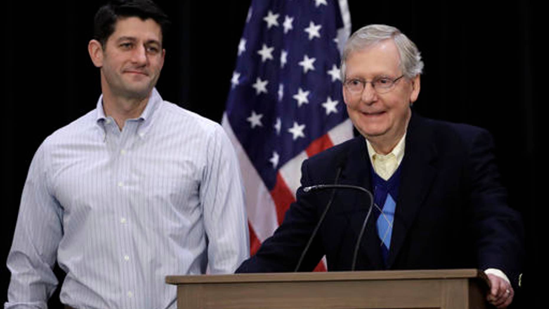 Senate Majority Leader Mitch McConnell of Ky., right, accompanied by House Speaker Paul Ryan of Wis., speaks with members of the media during a news conference at the Republican congressional retreat in Philadelphia, Thursday, Jan. 26, 2017. (AP Photo/Matt Rourke)
