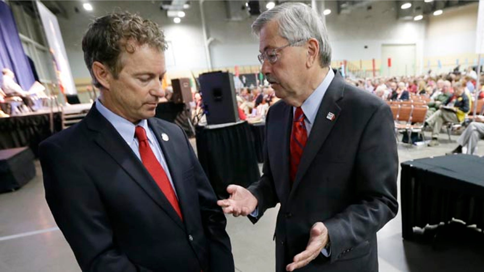 June 14, 2014: Iowa Gov. Terry Branstad, right, talks with Sen. Rand Paul, R-Ky., during the Iowa State Republican Convention in Des Moines, Iowa.