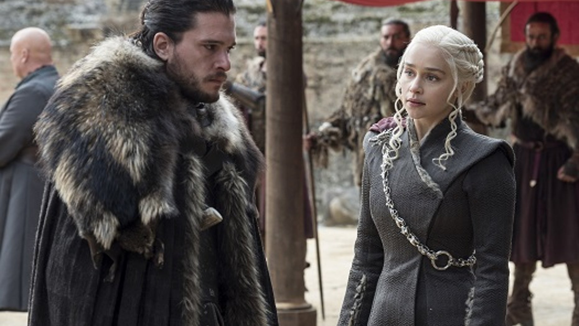 This image released by HBO shows Kit Harington, left, and Emilia Clarke on the season finale of