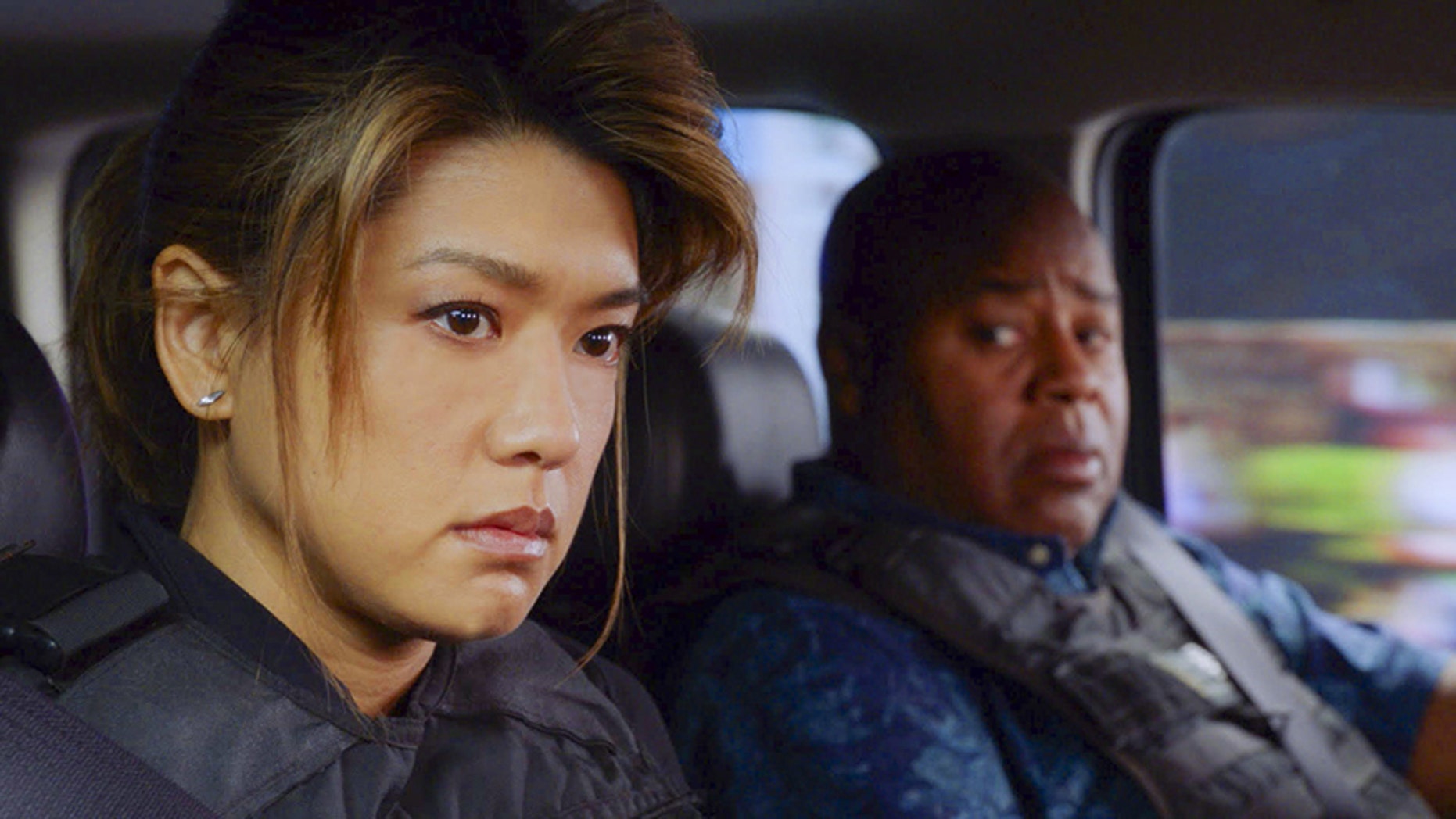 Pictured left to right: Grace Park as Kono Kalakaua and Chi McBride as Lou Grover in CBS' "Hawaii 5-0."