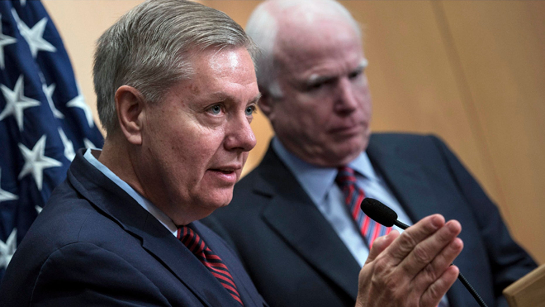 Jan. 3, 2014: Sen. Lindsey Graham, R-S.C., left, speaks near Sen. John McCain, R-Ariz., during a news conference at the David Citadel hotel in Jerusalem.